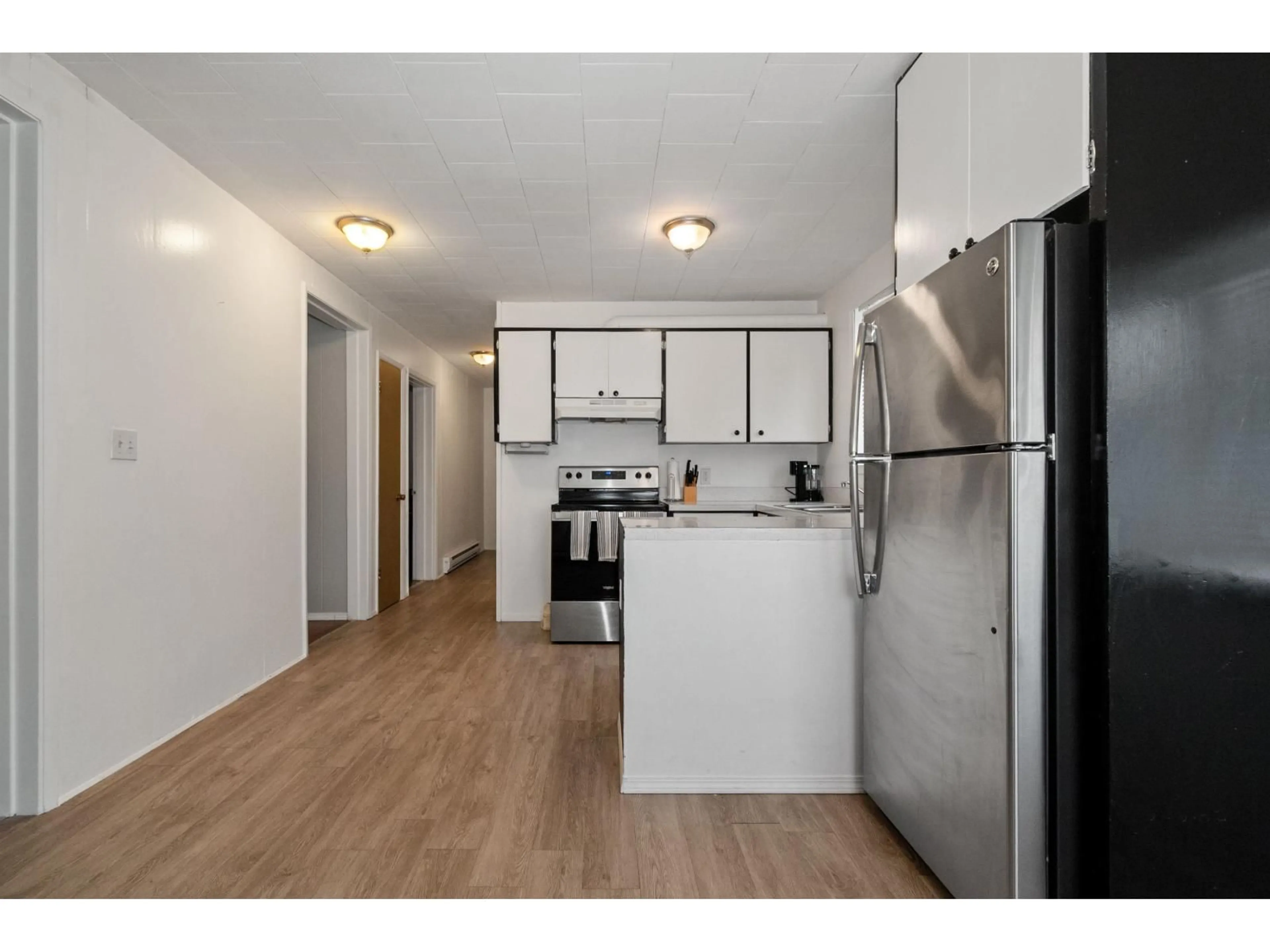 Standard kitchen, wood/laminate floor for 65321 PINE CLOSE ROAD, Boston Bar British Columbia V0K1C0