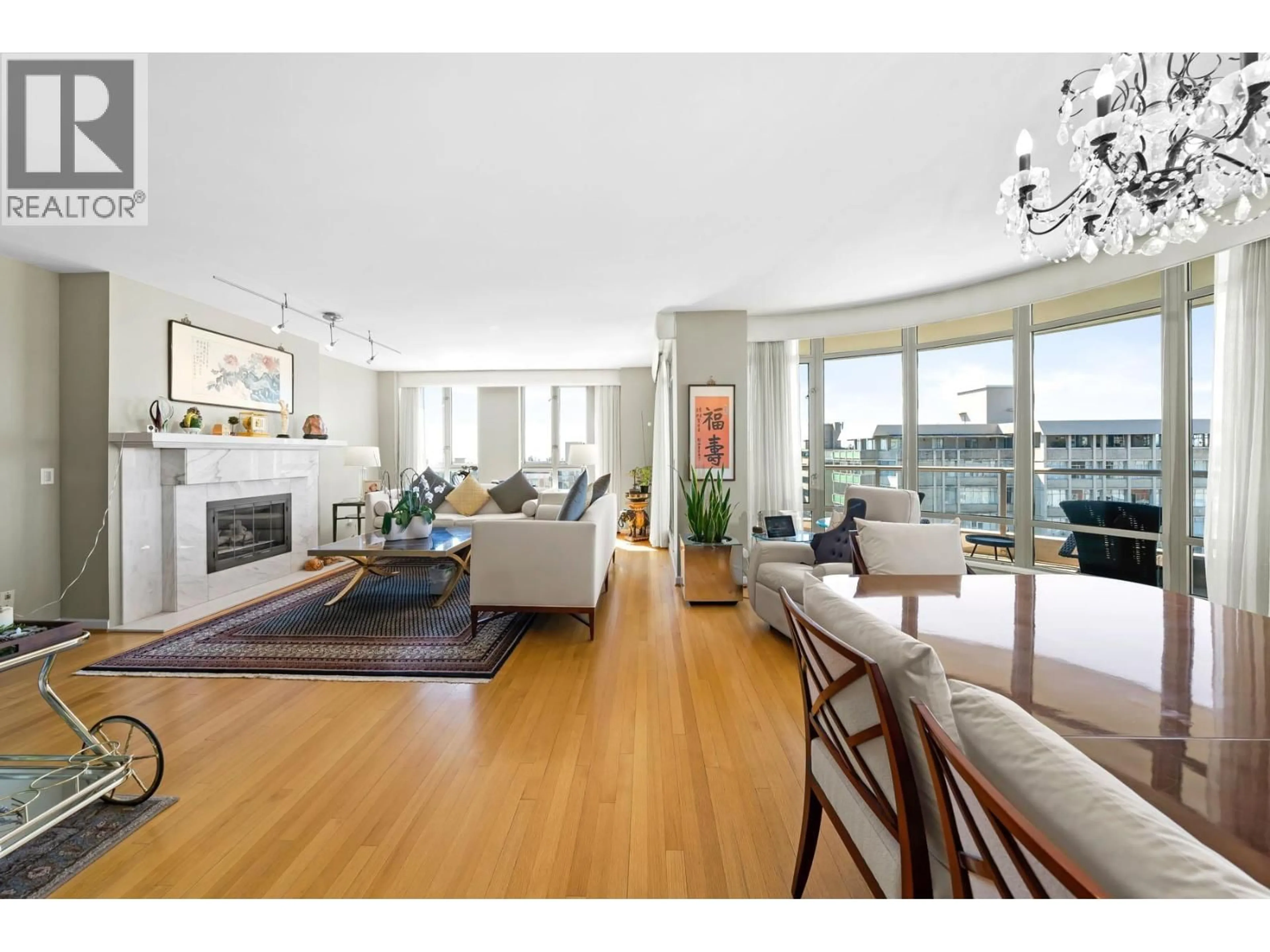 Living room with furniture, wood/laminate floor for 901 - 5850 BALSAM STREET, Vancouver British Columbia V6M4B9