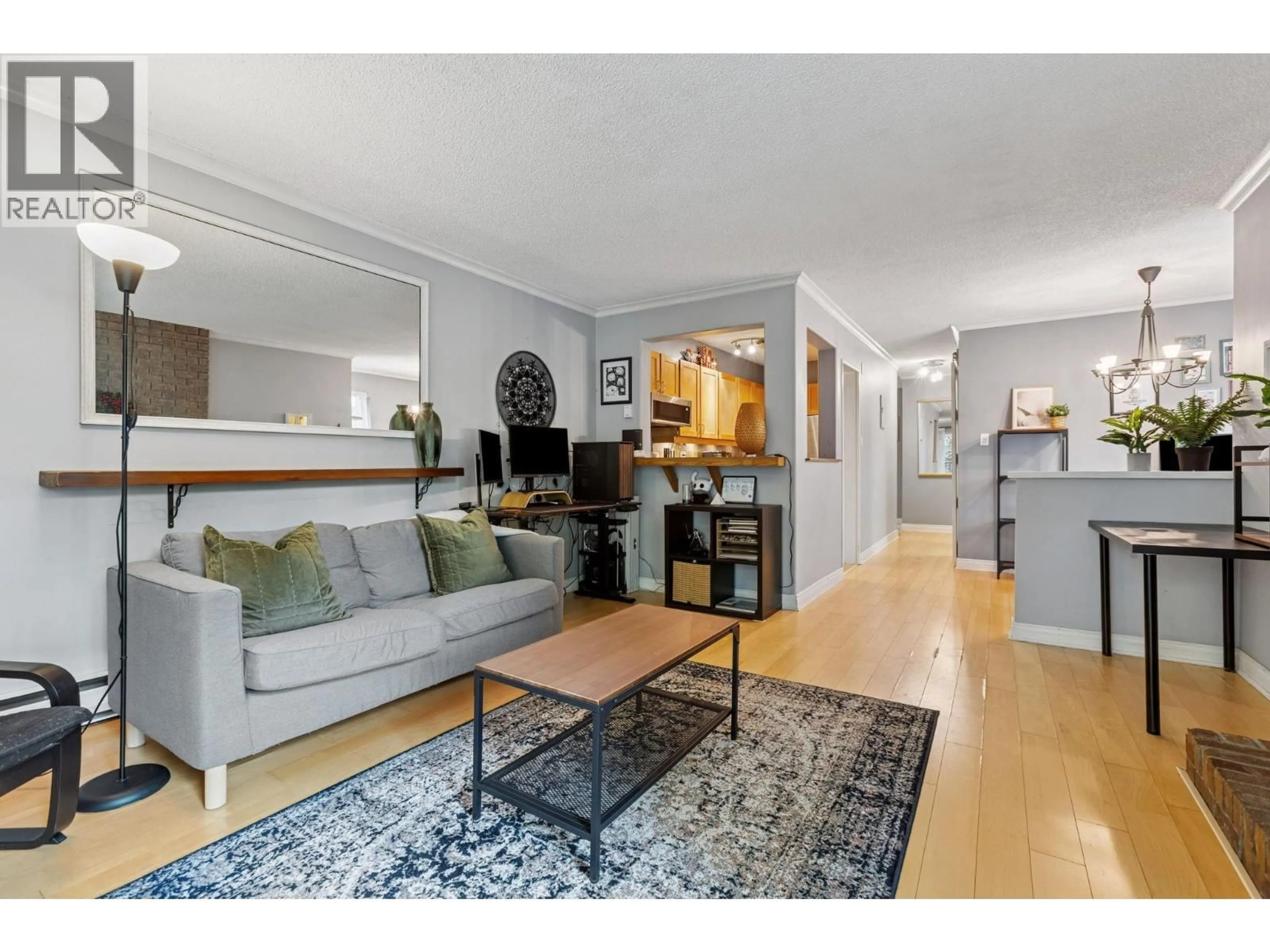 Living room with furniture, wood/laminate floor for 204 - 1234 PENDRELL STREET, Vancouver British Columbia V6E1L6