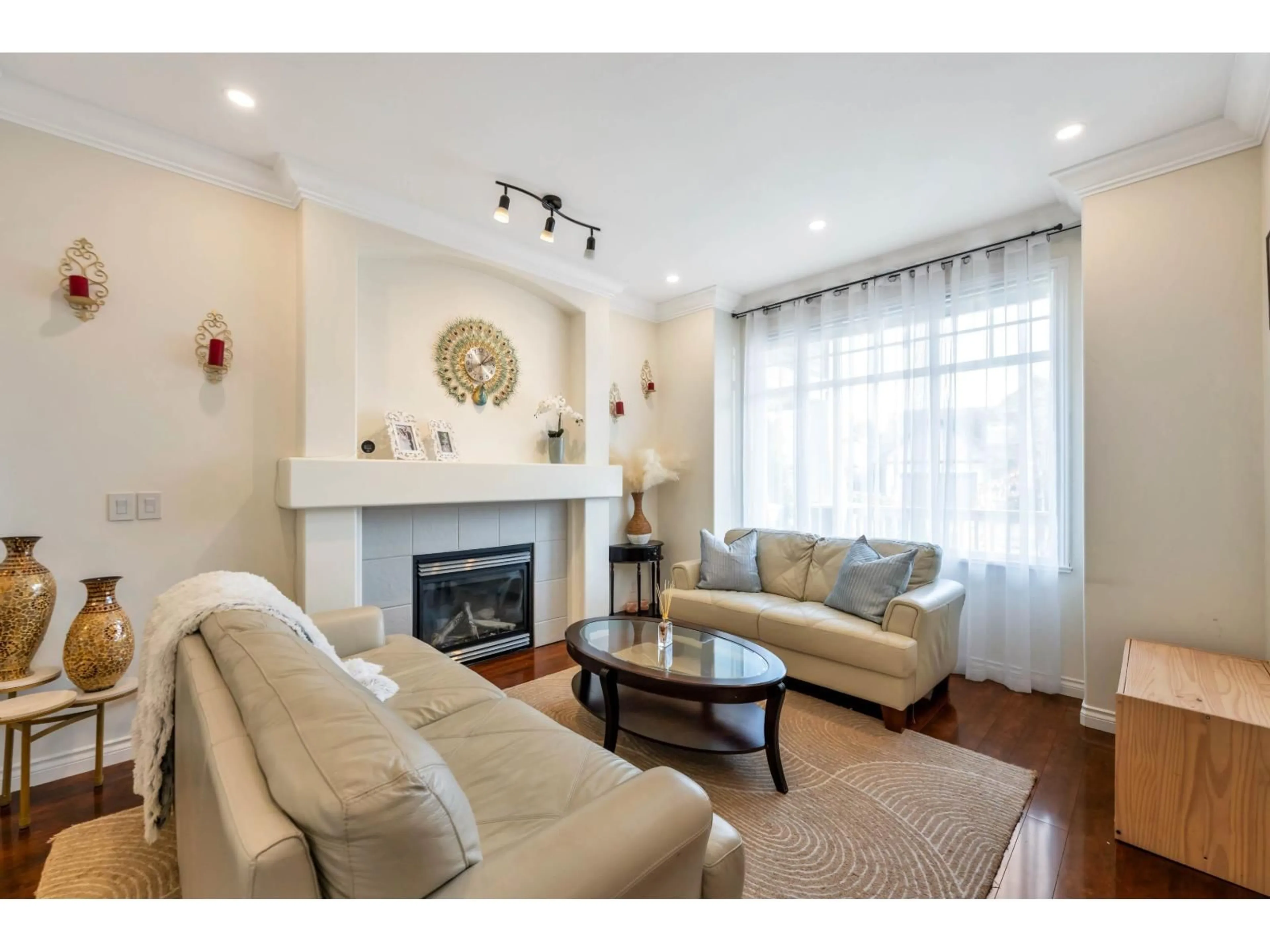 Living room with furniture, wood/laminate floor for 6185 167A STREET, Surrey British Columbia V3S9L1