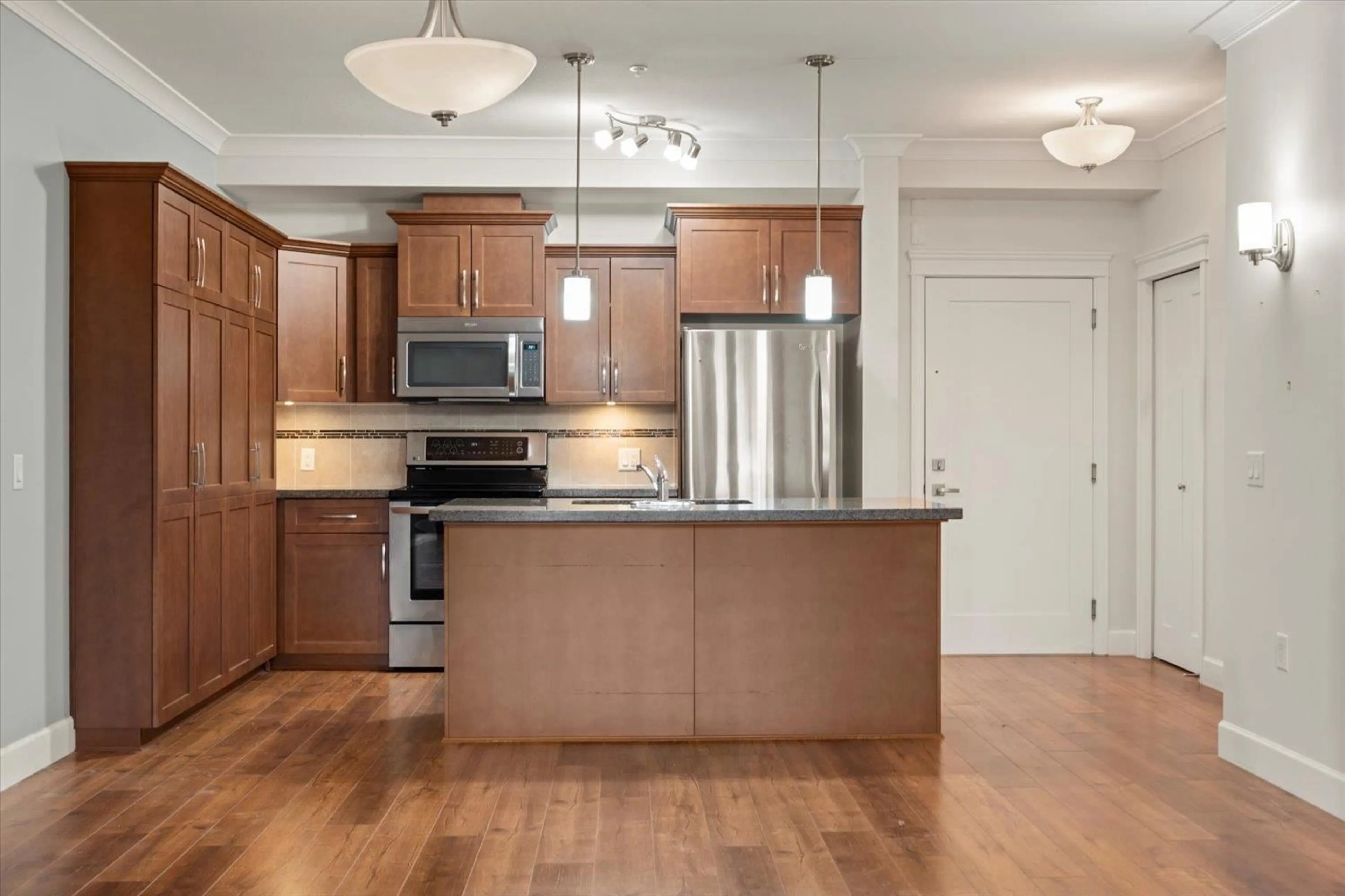 Open concept kitchen, wood/laminate floor for 201 - 45750 KEITH WILSON ROAD, Chilliwack British Columbia V2R0X3