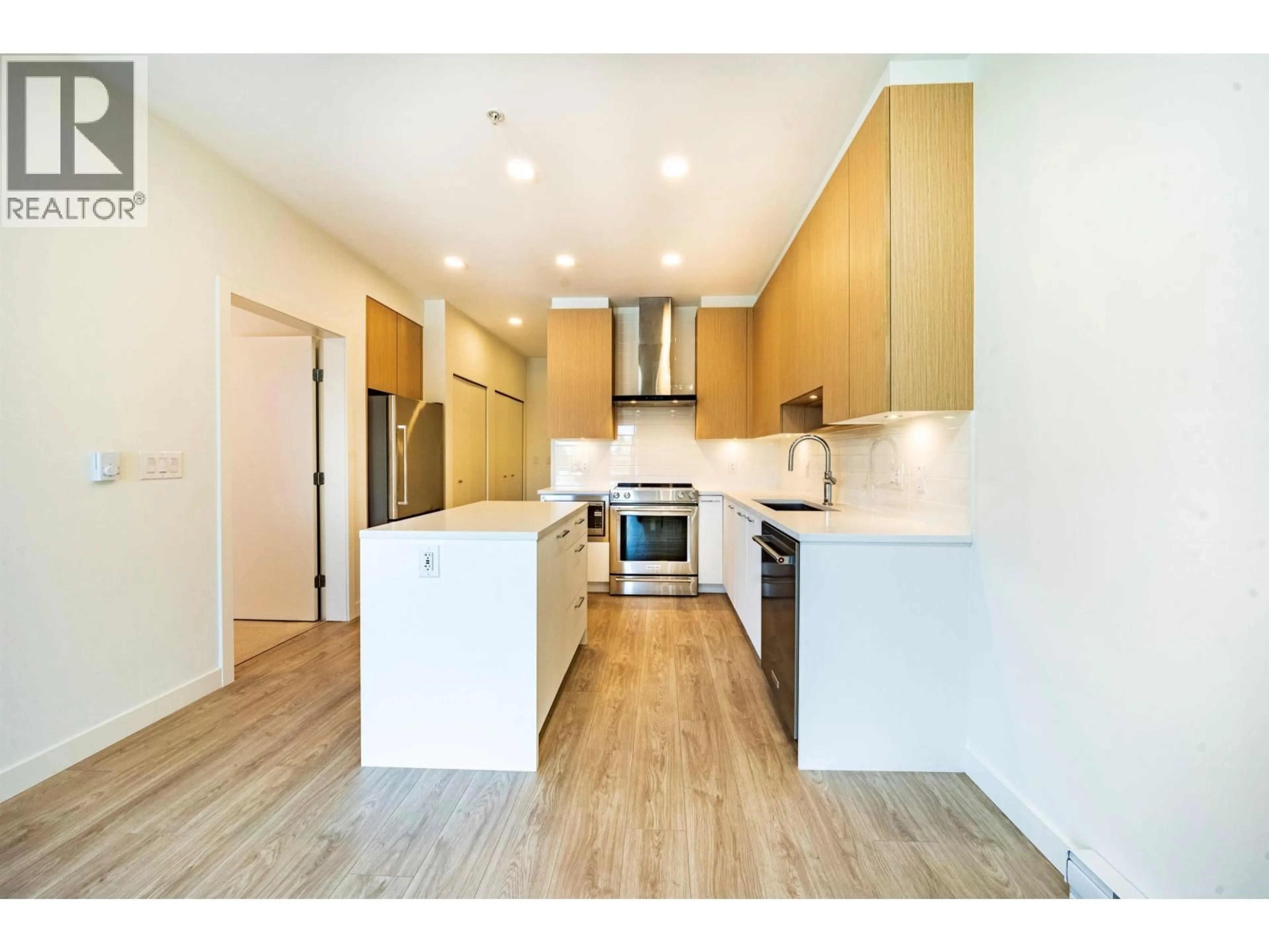 Open concept kitchen, wood/laminate floor for 406 - 7599 15TH STREET, Burnaby British Columbia V3N0H9