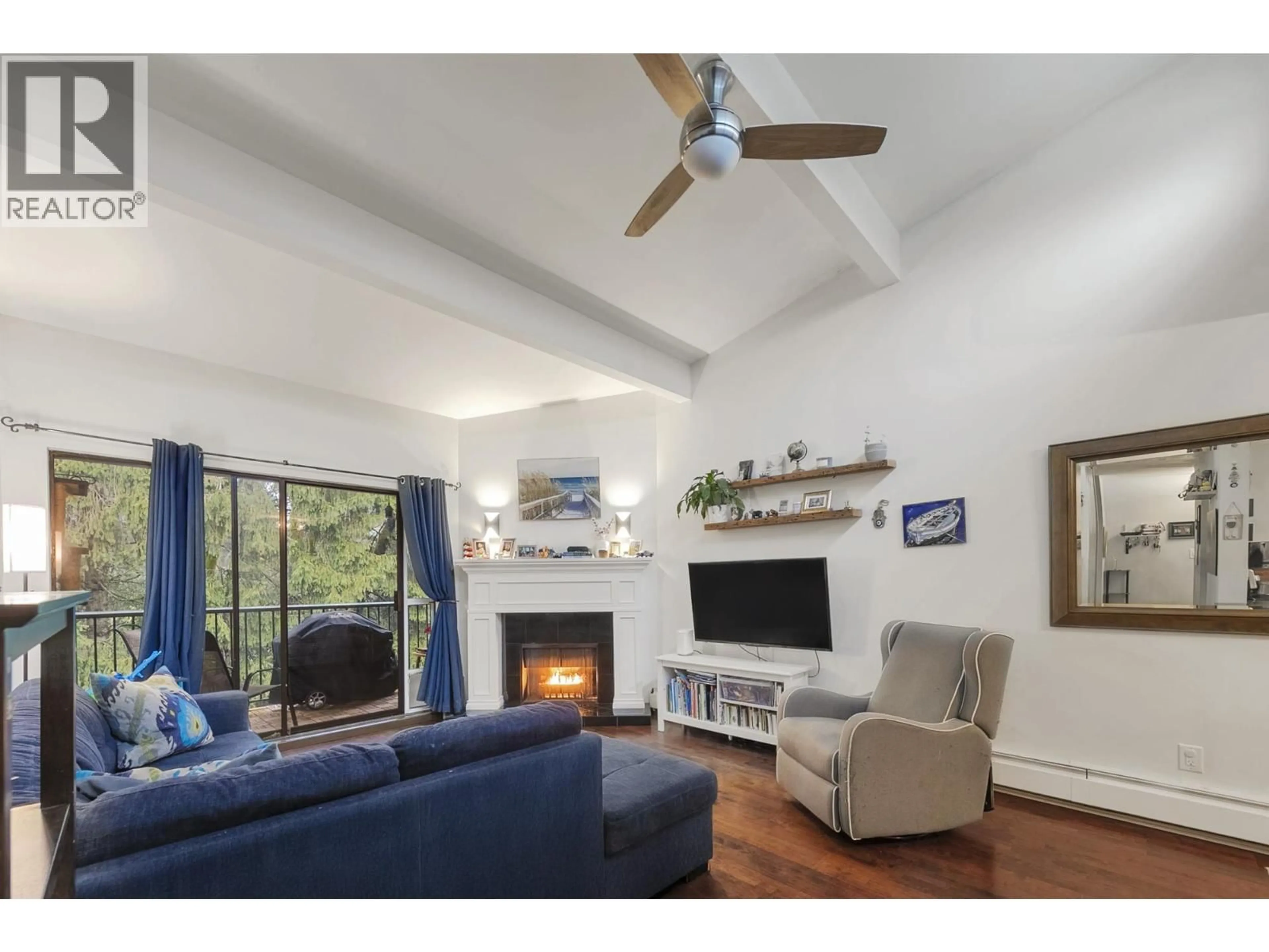 Living room with furniture, wood/laminate floor for 326 - 9101 HORNE STREET STREET, Burnaby British Columbia V3N4M3