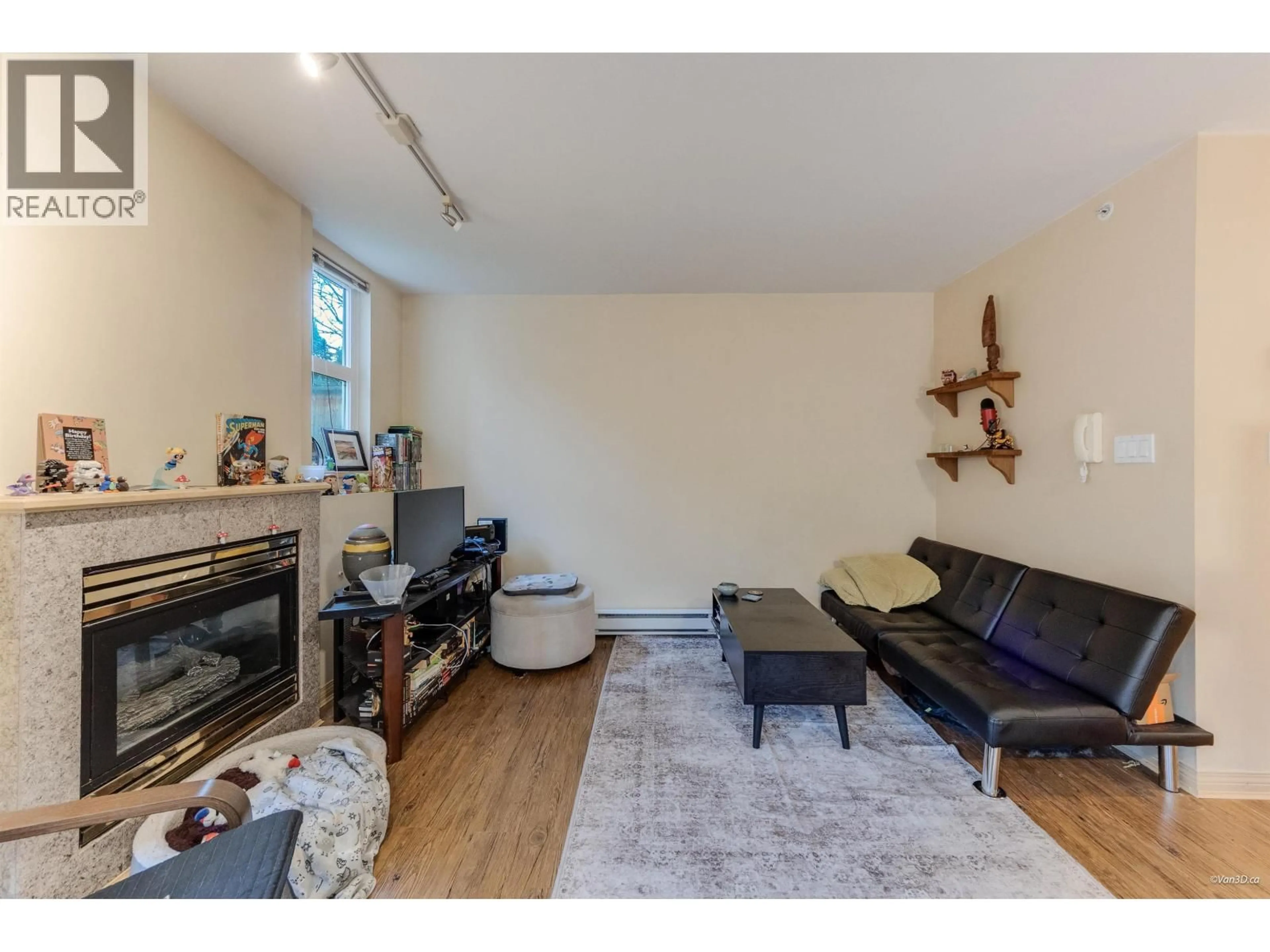 Living room with furniture, wood/laminate floor for 101 - 1099 71ST AVENUE, Vancouver British Columbia V6P6Y5