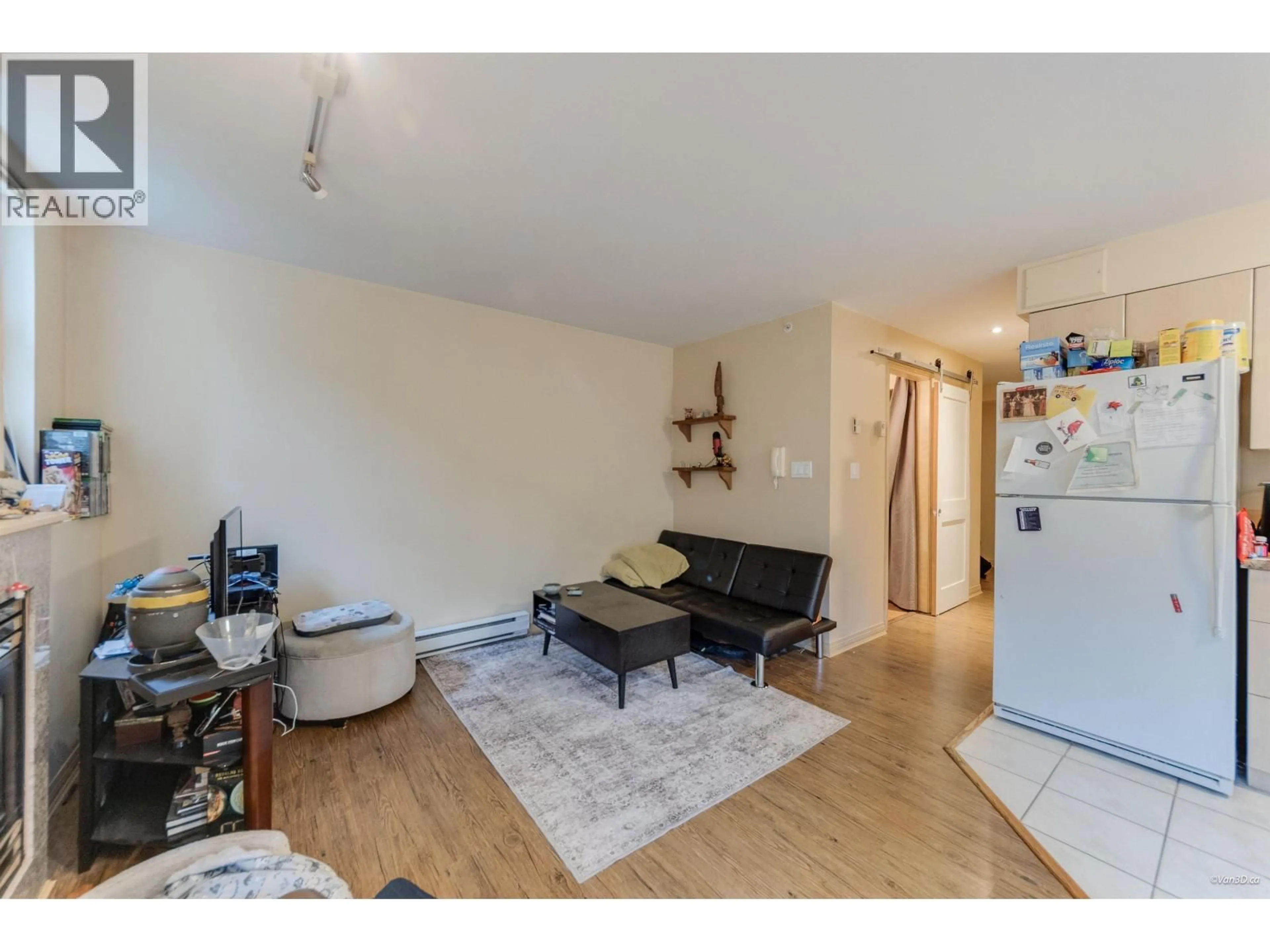 Living room with furniture, wood/laminate floor for 101 - 1099 71ST AVENUE, Vancouver British Columbia V6P6Y5