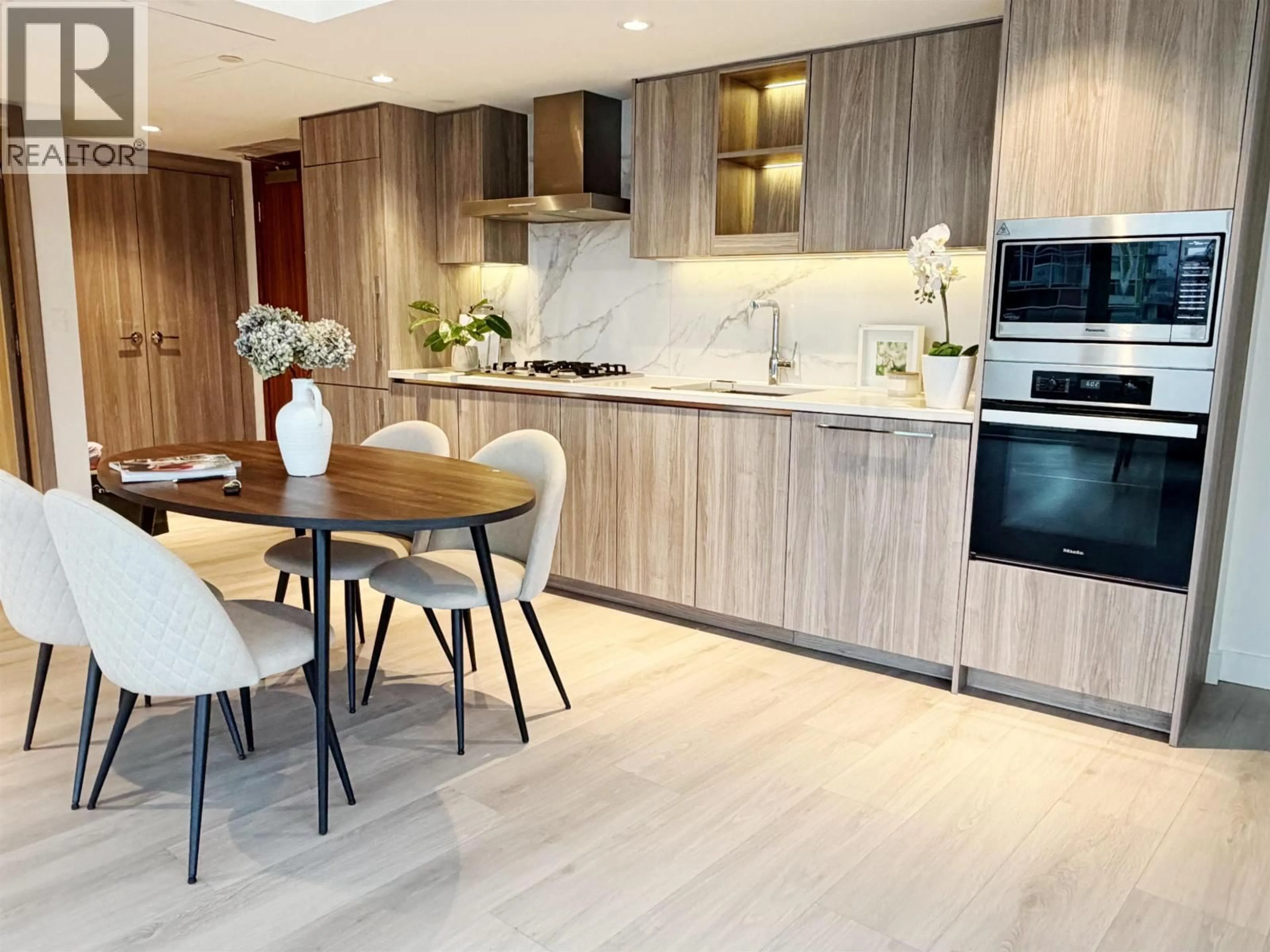 Open concept kitchen, wood/laminate floor for 1385 - 8608 HAZELBRIDGE WAY, Richmond British Columbia V6X0W2