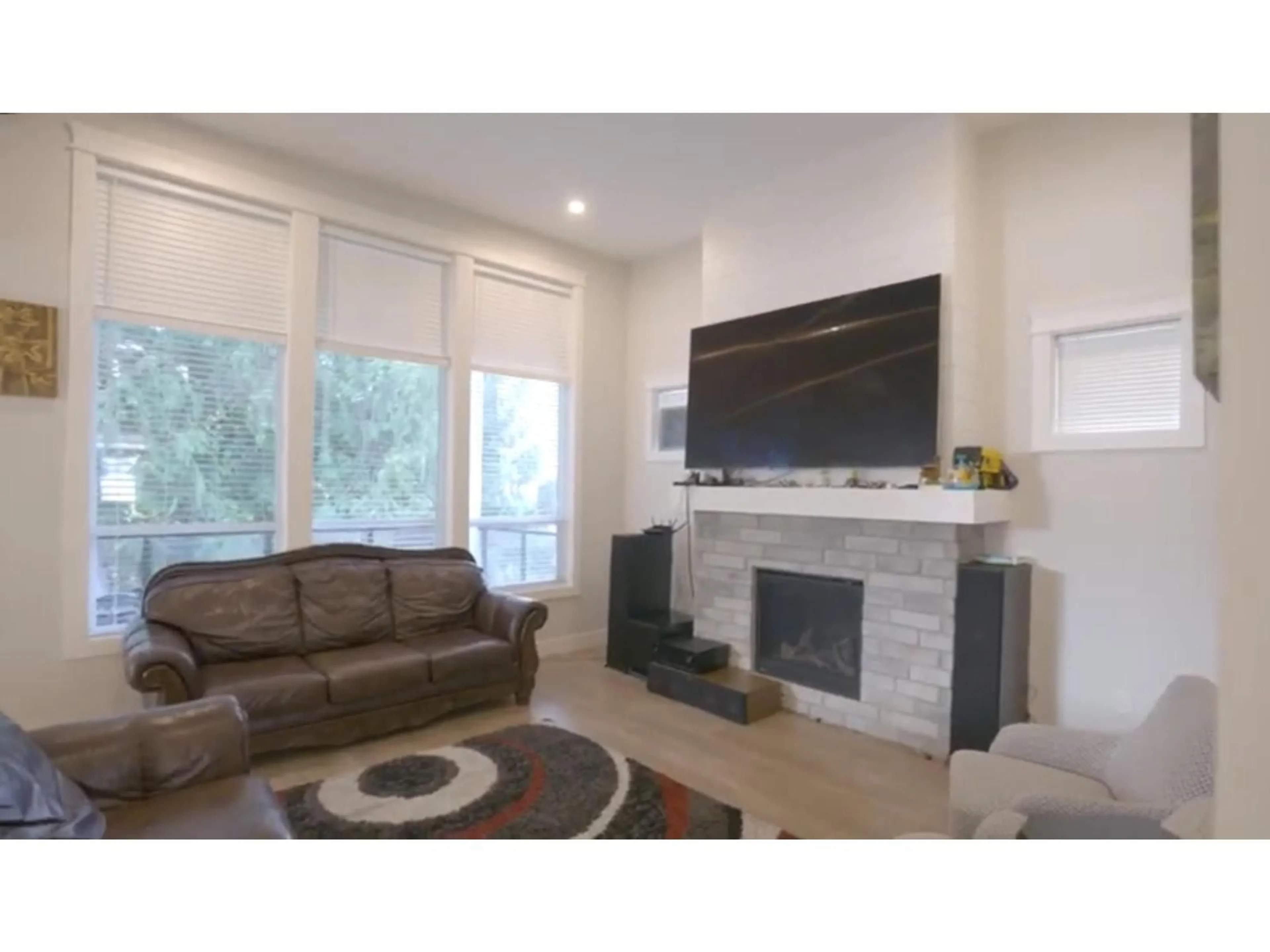 Living room with furniture, wood/laminate floor for 21 - 4217 OLD CLAYBURN ROAD, Abbotsford British Columbia V3G1L5
