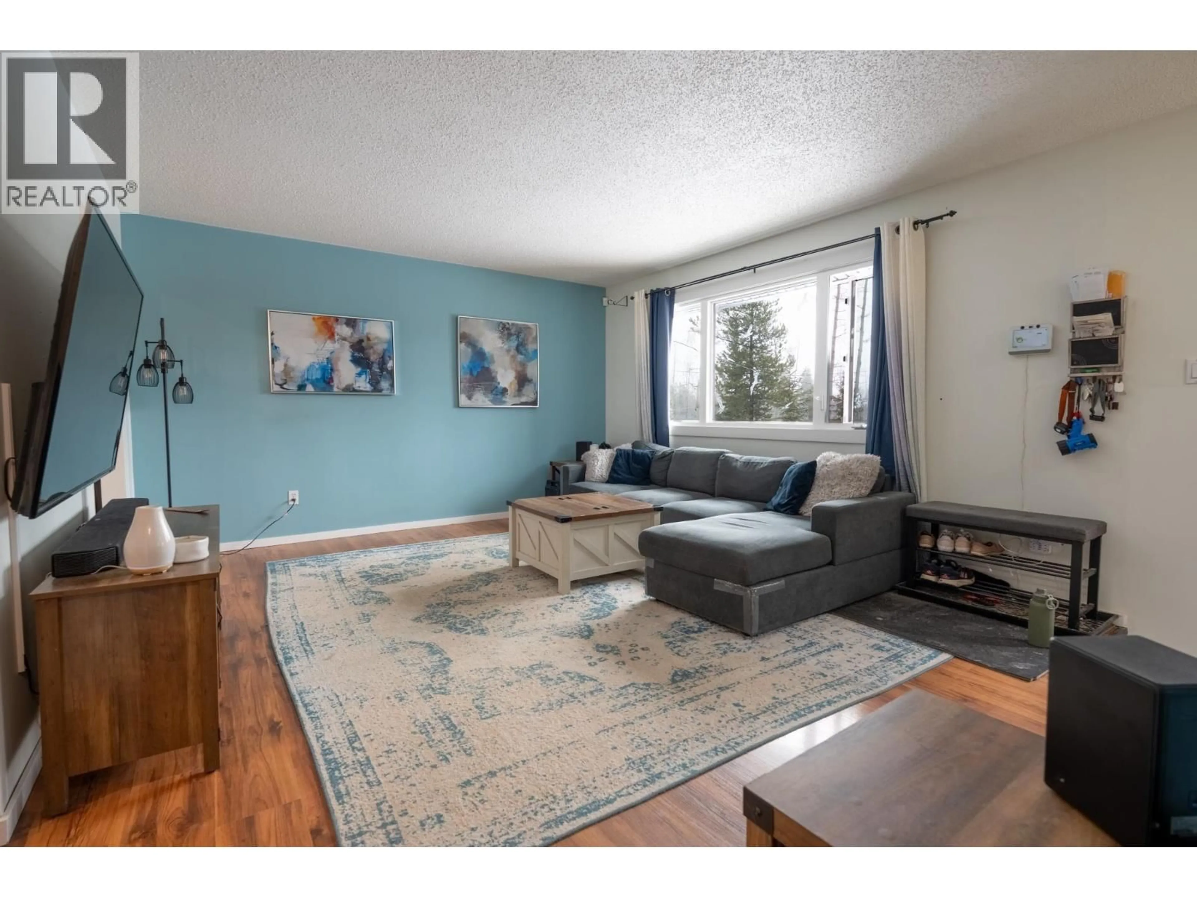 Living room with furniture, wood/laminate floor for 12500 HILLCREST DRIVE, Prince George British Columbia V2N5C2
