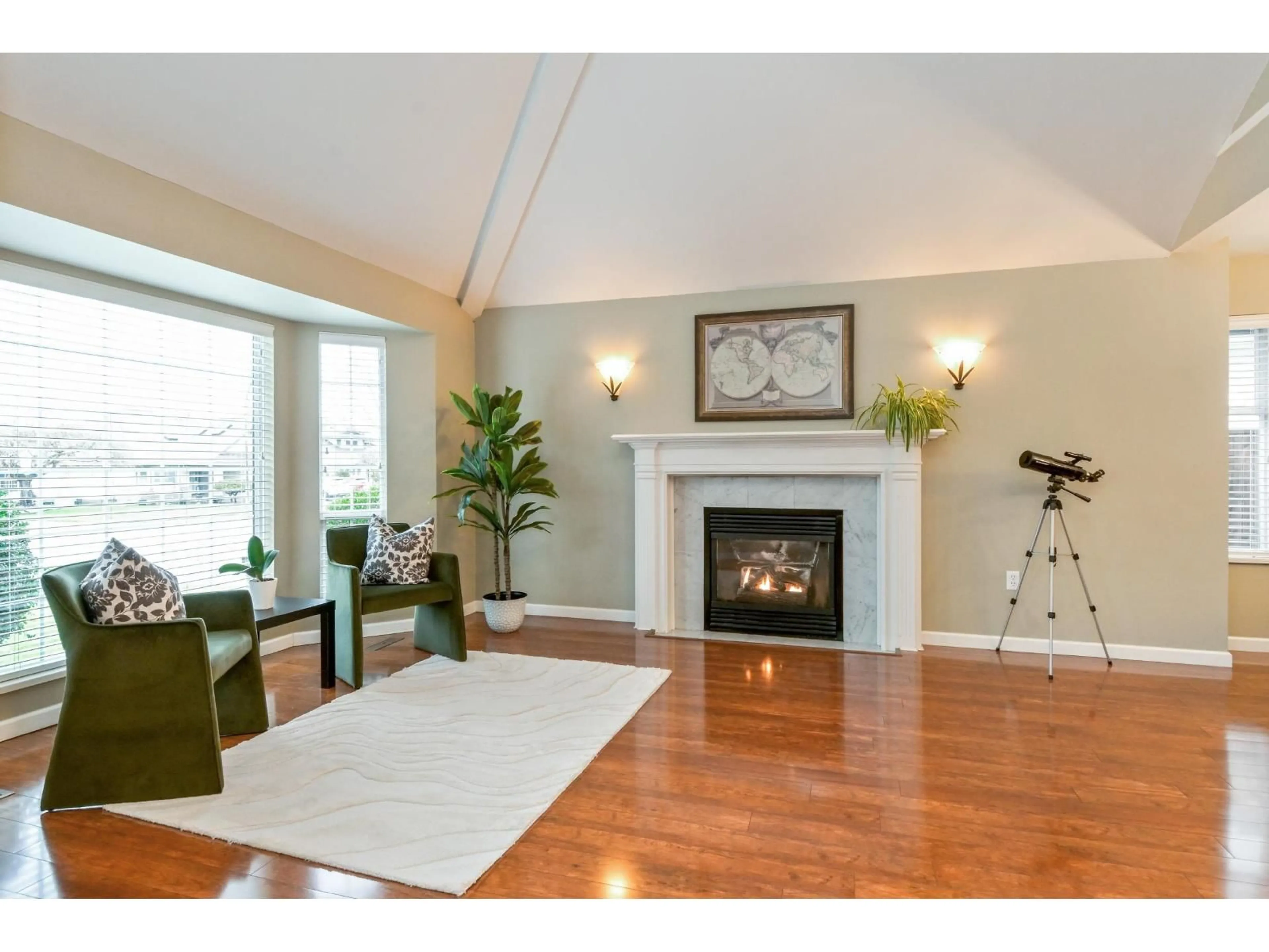 Living room with furniture, wood/laminate floor for 4552 217A STREET, Langley British Columbia V3A9B9