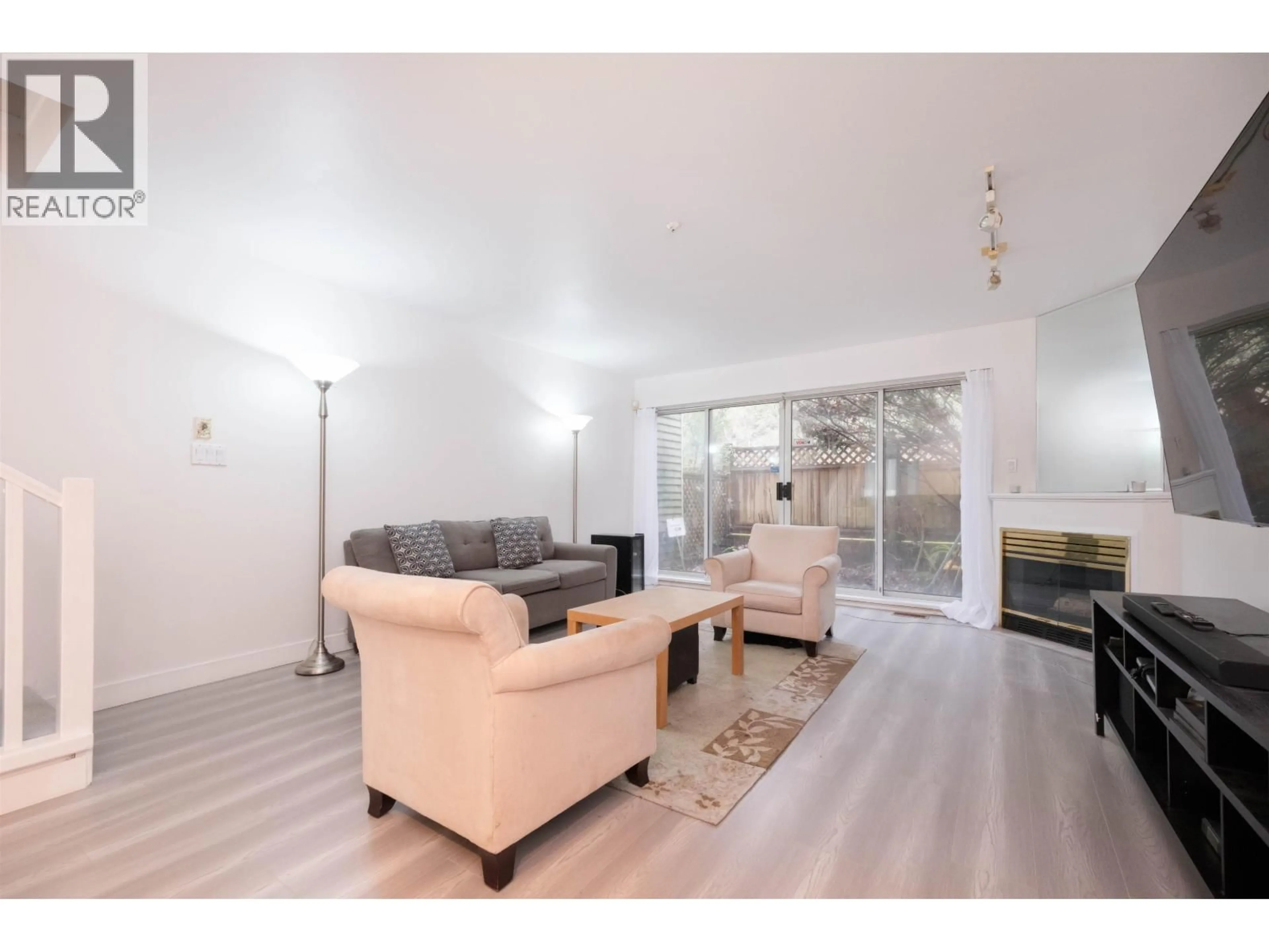 Living room with furniture, wood/laminate floor for 3371 FIELDSTONE AVENUE, Vancouver British Columbia V5S4R9