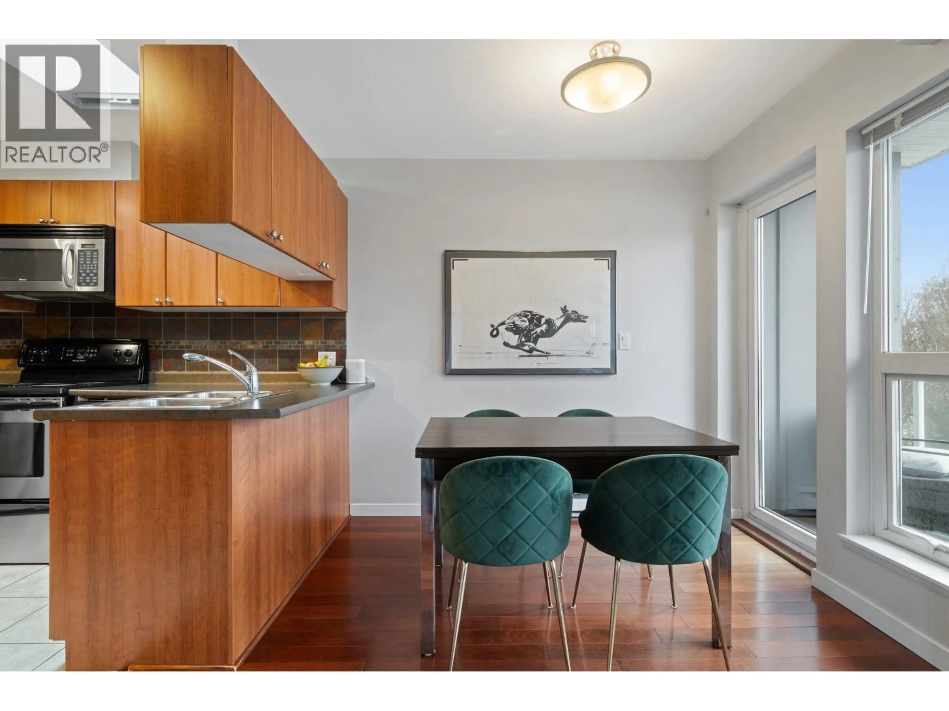 Open concept kitchen, wood/laminate floor for 412 - 2891 HASTINGS STREET, Vancouver British Columbia V5K5J8