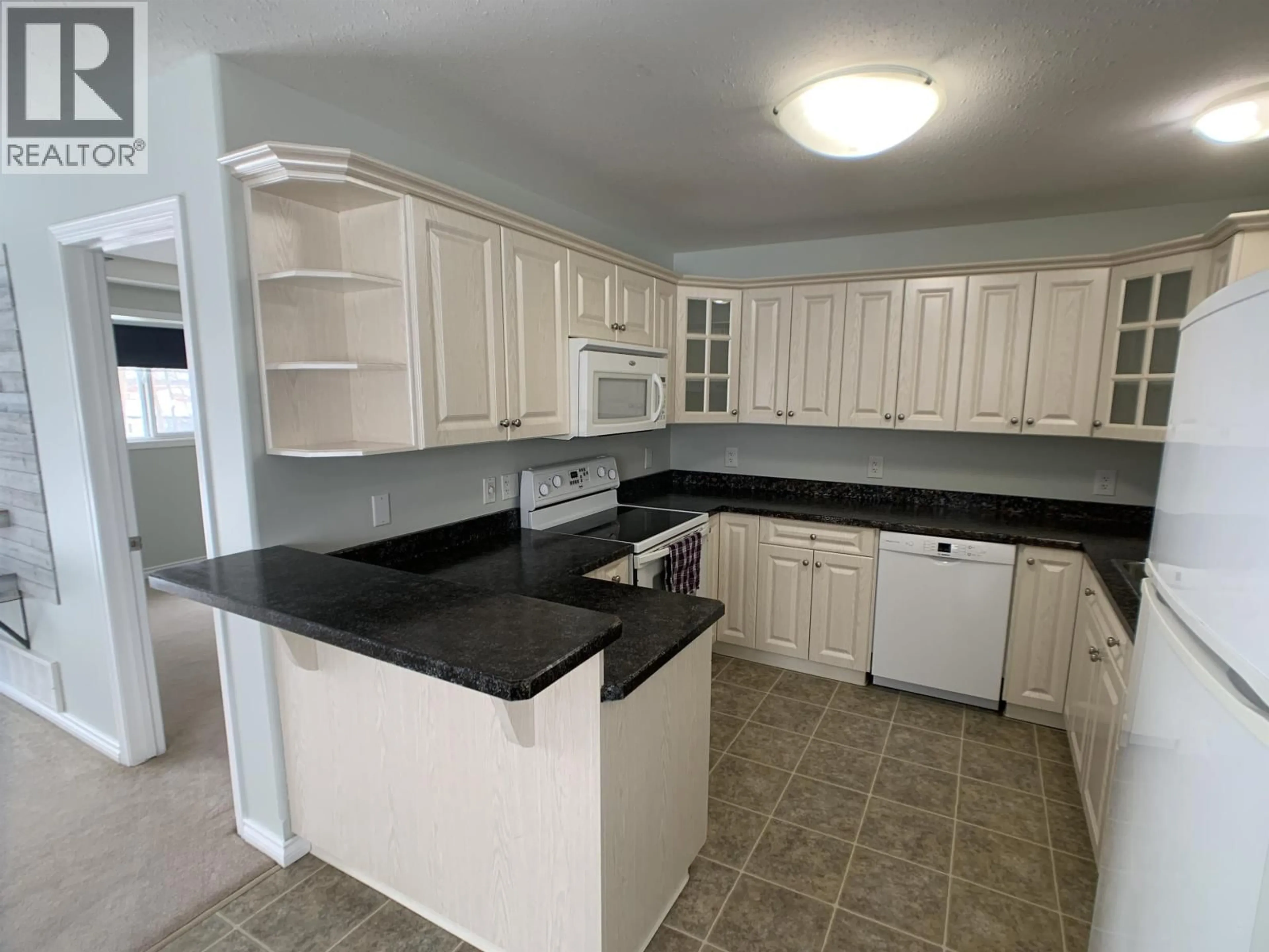 Standard kitchen, ceramic/tile floor for A - 4415 HERITAGE CRESCENT, Fort Nelson British Columbia V0C1R0