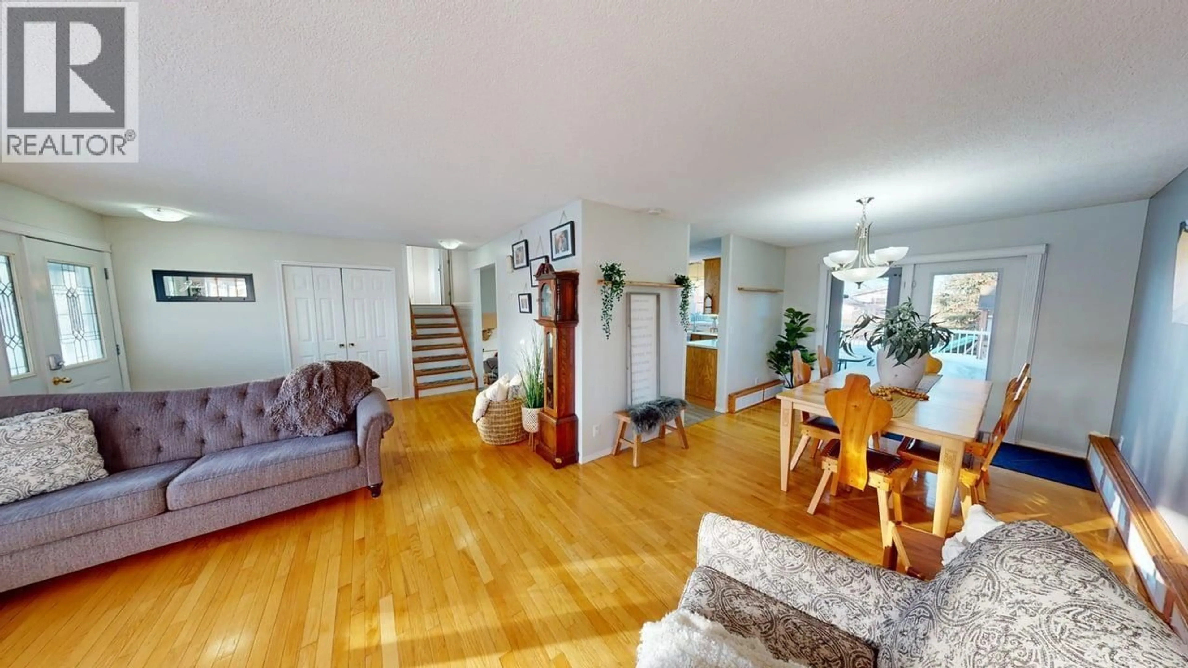 Living room with furniture, wood/laminate floor for 9420 105 AVENUE, Fort St. John British Columbia V1J4V7