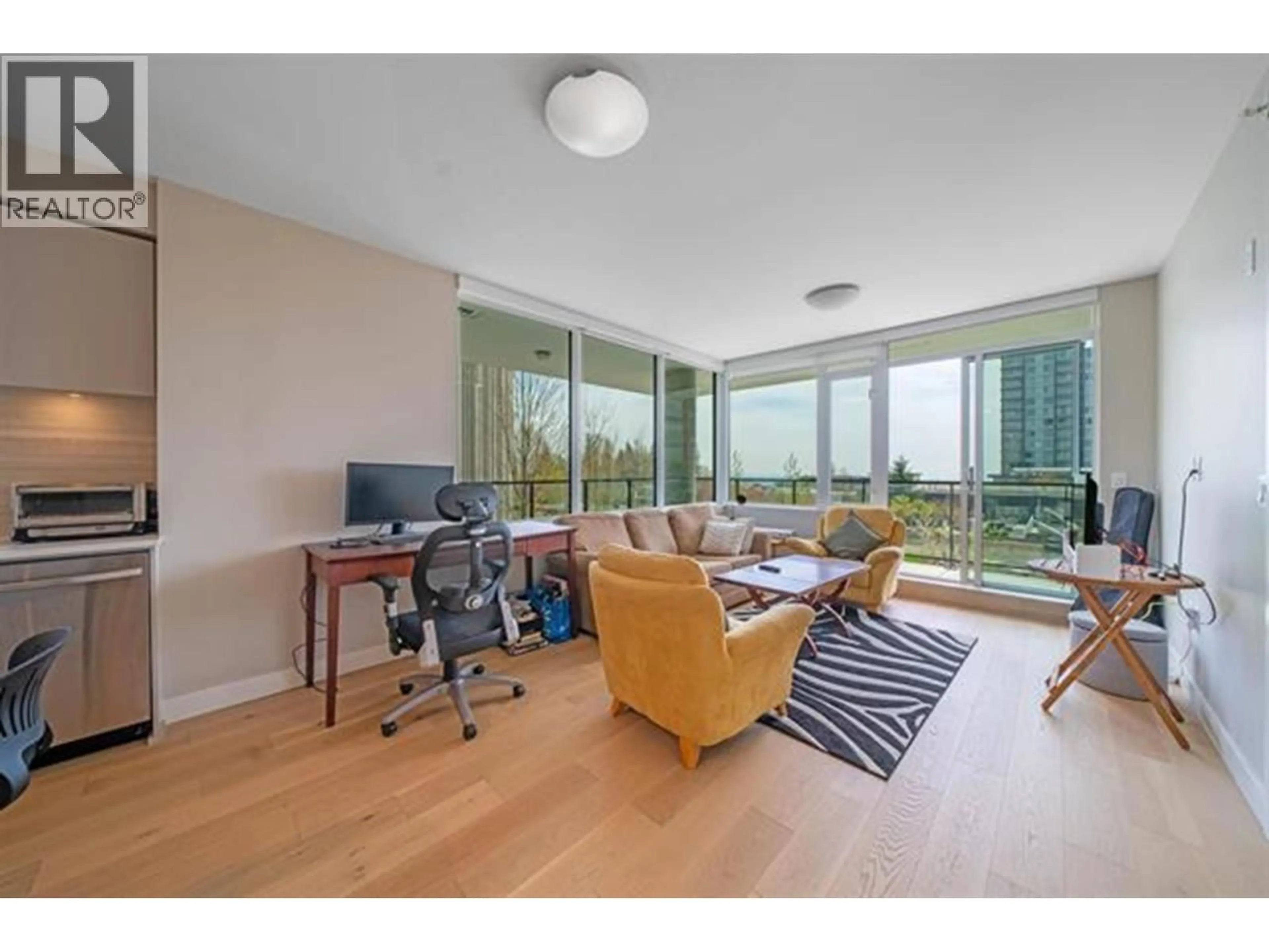 Living room with furniture, wood/laminate floor for 504 - 8761 UNIVERSITY CRESCENT, Burnaby British Columbia V5A4Y8