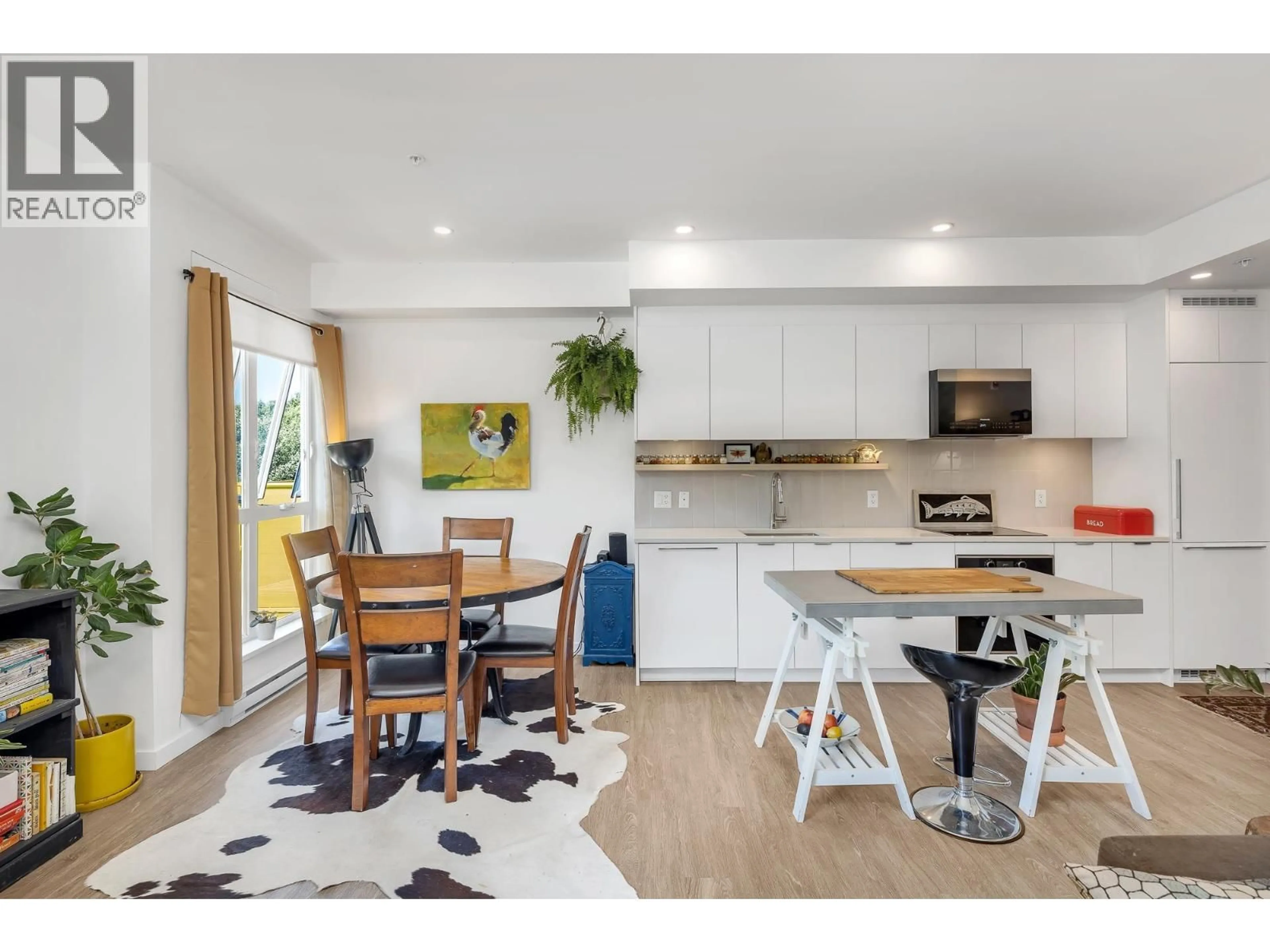 Open concept kitchen, wood/laminate floor for 301 - 37762 THIRD AVENUE, Squamish British Columbia V8B1C3