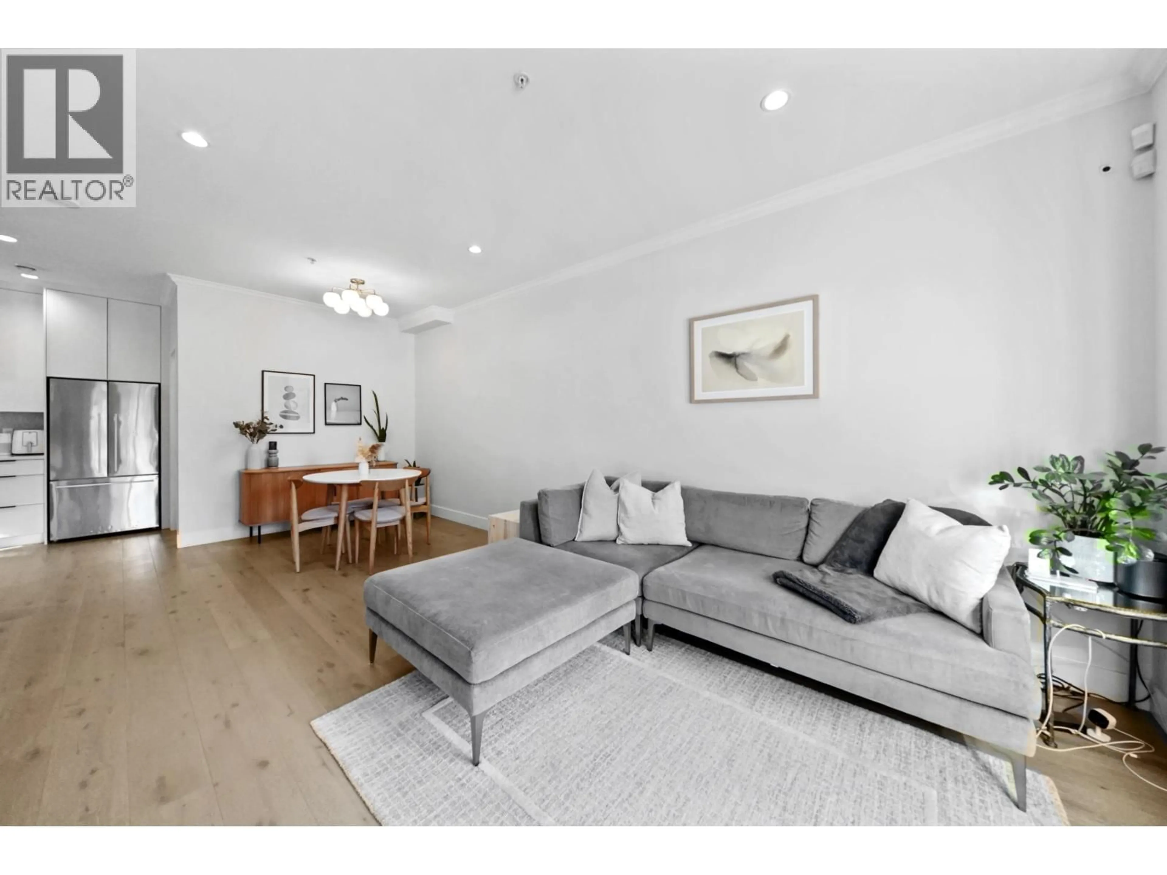 Living room with furniture, wood/laminate floor for 5650 MAIN STREET, Vancouver British Columbia V5W2S4