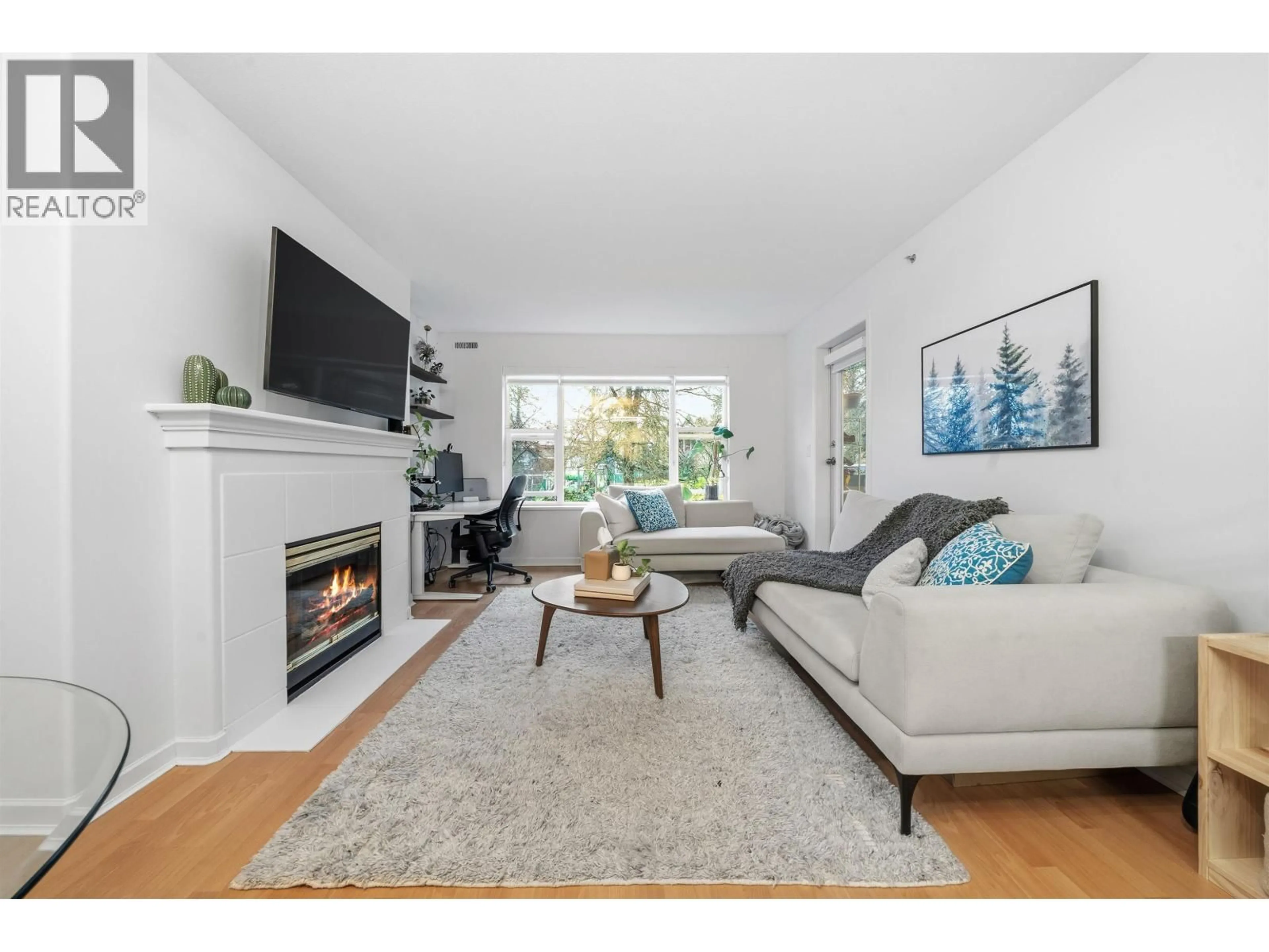 Living room with furniture, wood/laminate floor for 210 - 5281 OAKMOUNT CRESCENT, Burnaby British Columbia V5H4S7