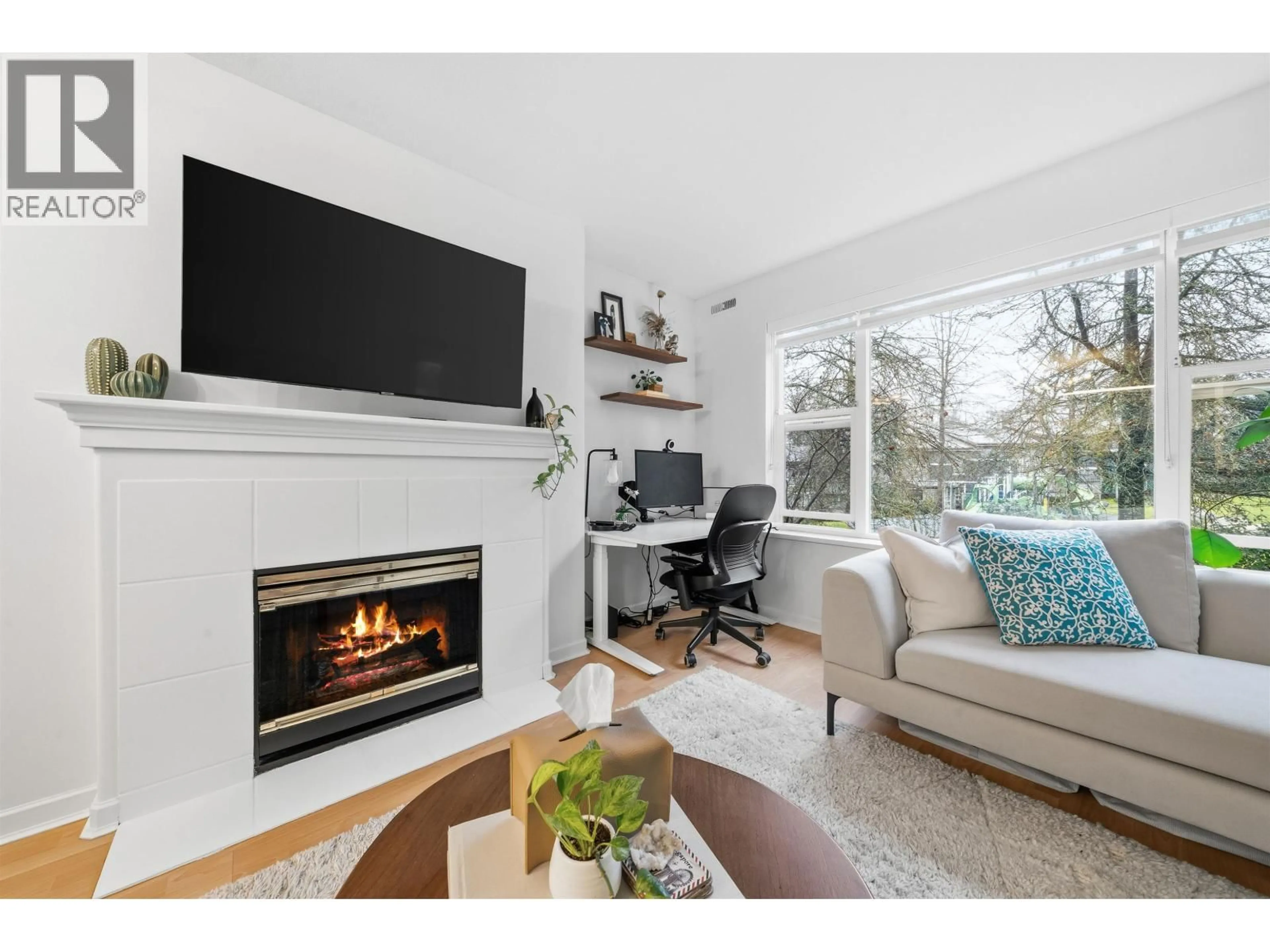 Living room with furniture, wood/laminate floor for 210 - 5281 OAKMOUNT CRESCENT, Burnaby British Columbia V5H4S7