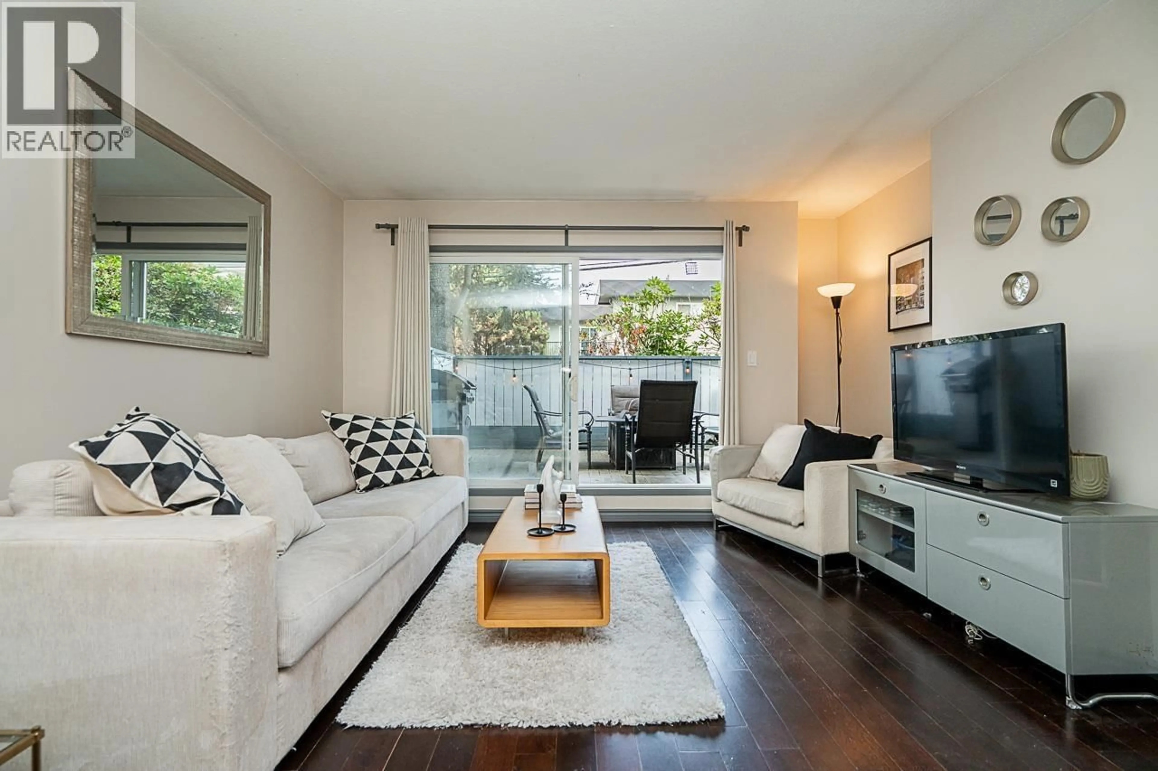 Living room with furniture, wood/laminate floor for 105 - 2255 ETON STREET, Vancouver British Columbia V5L1C9