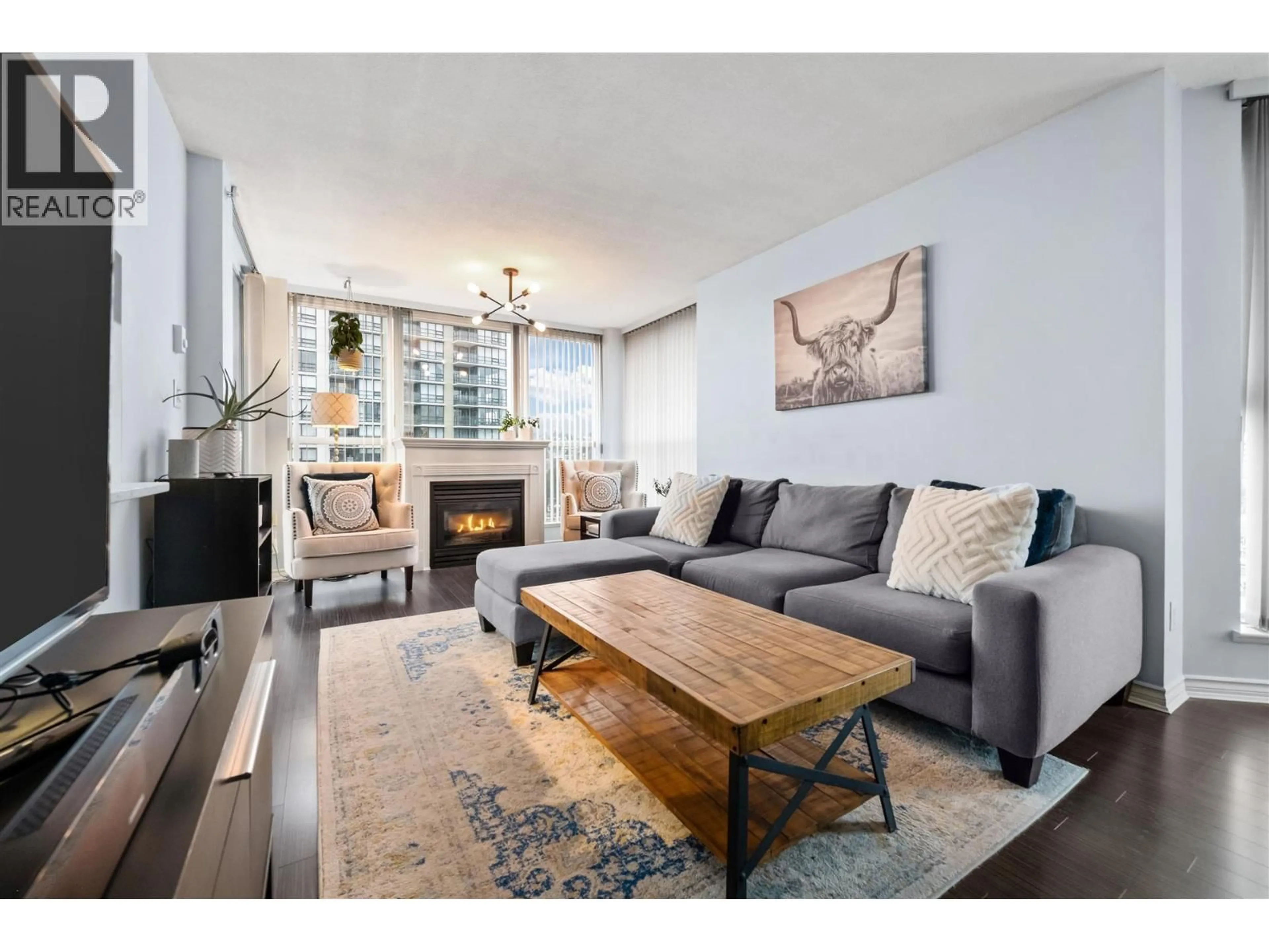 Living room with furniture, wood/laminate floor for 1006 - 10 LAGUNA COURT, New Westminster British Columbia V3M6W3