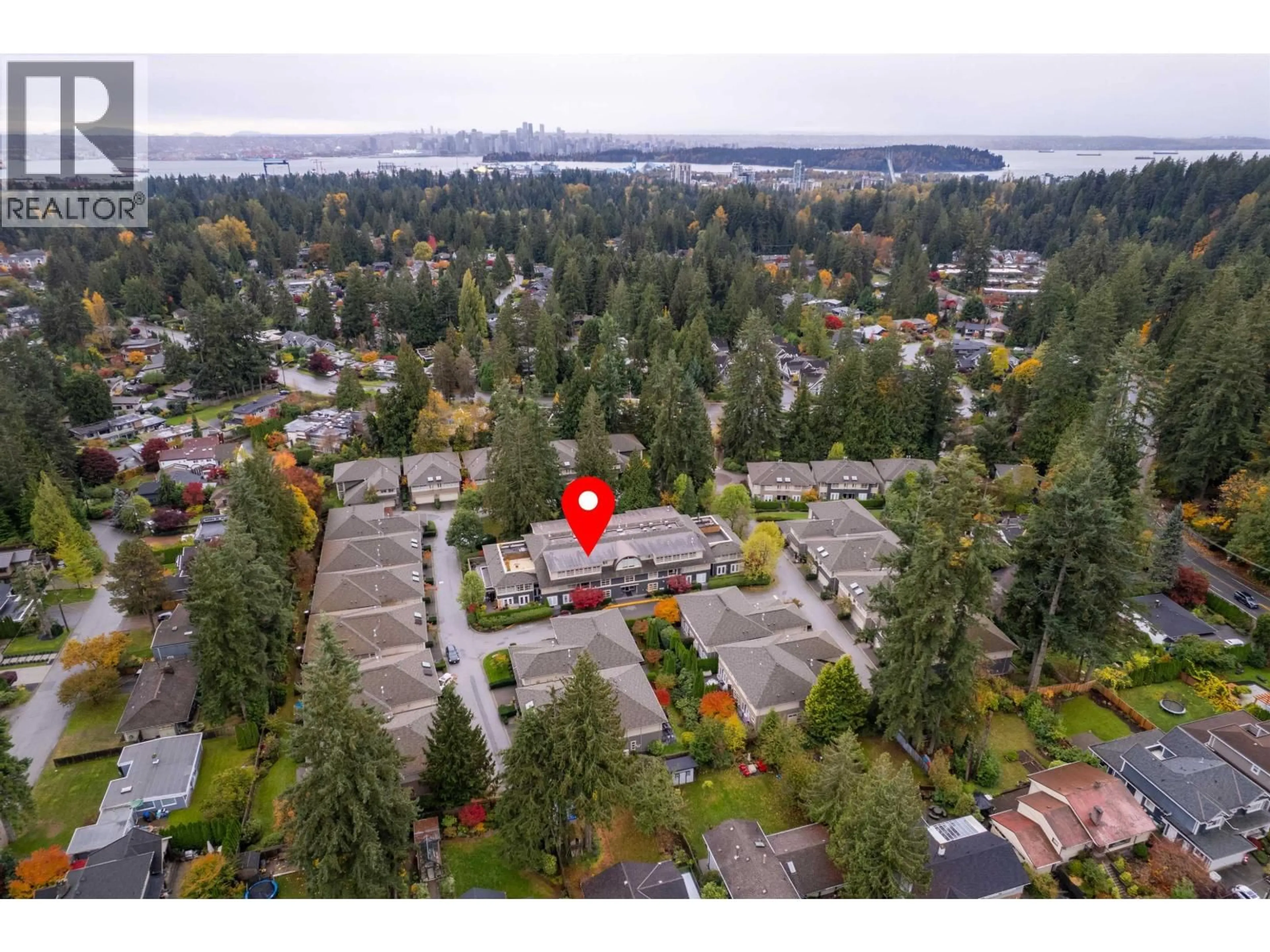 A pic from outside/outdoor area/front of a property/back of a property/a pic from drone, water/lake/river/ocean view for 104 - 3750 EDGEMONT BOULEVARD, North Vancouver British Columbia V7R2P8