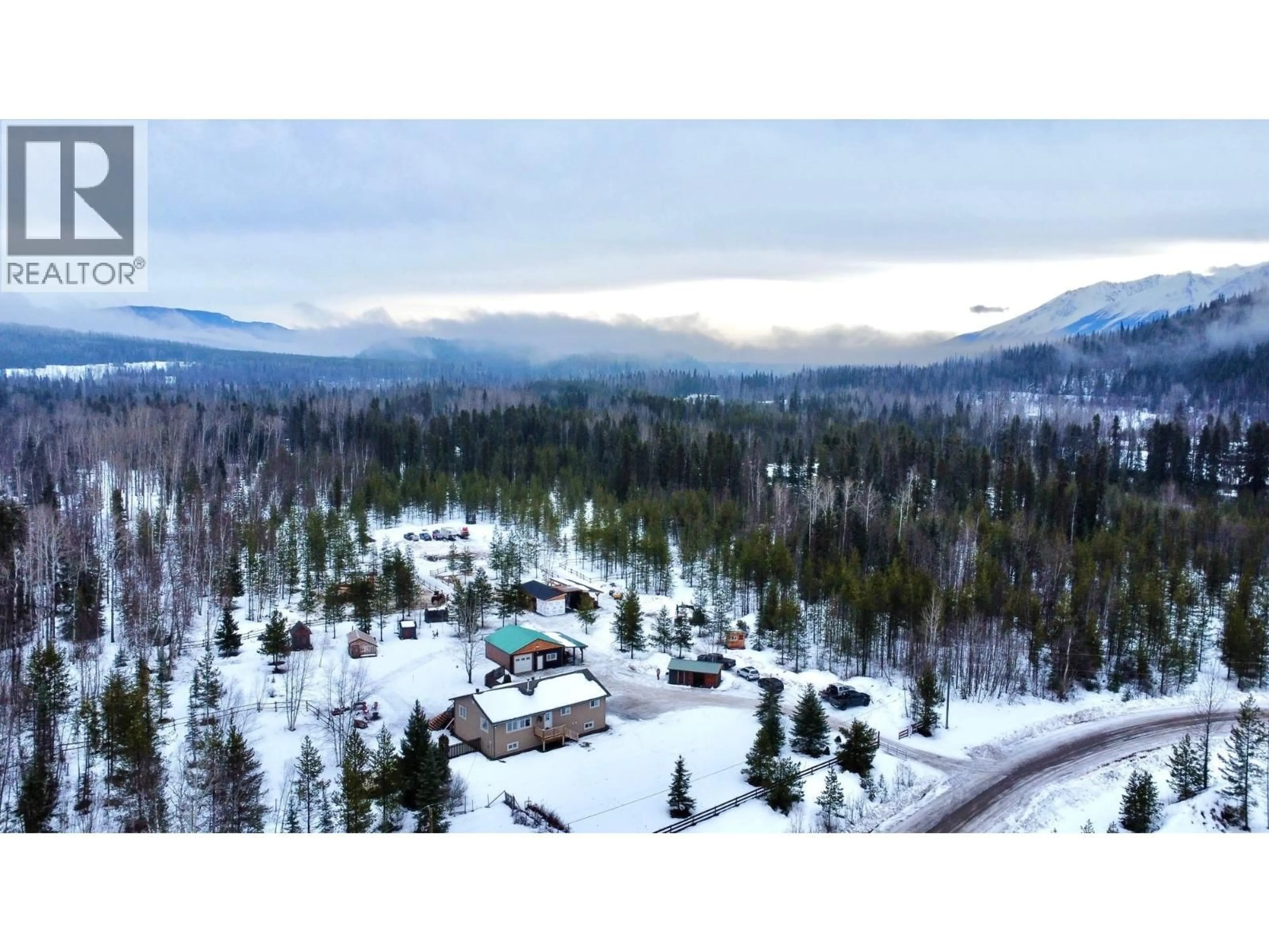 A pic from outside/outdoor area/front of a property/back of a property/a pic from drone, mountain view for 23998 RIVER ROAD, Smithers British Columbia V0J2N1