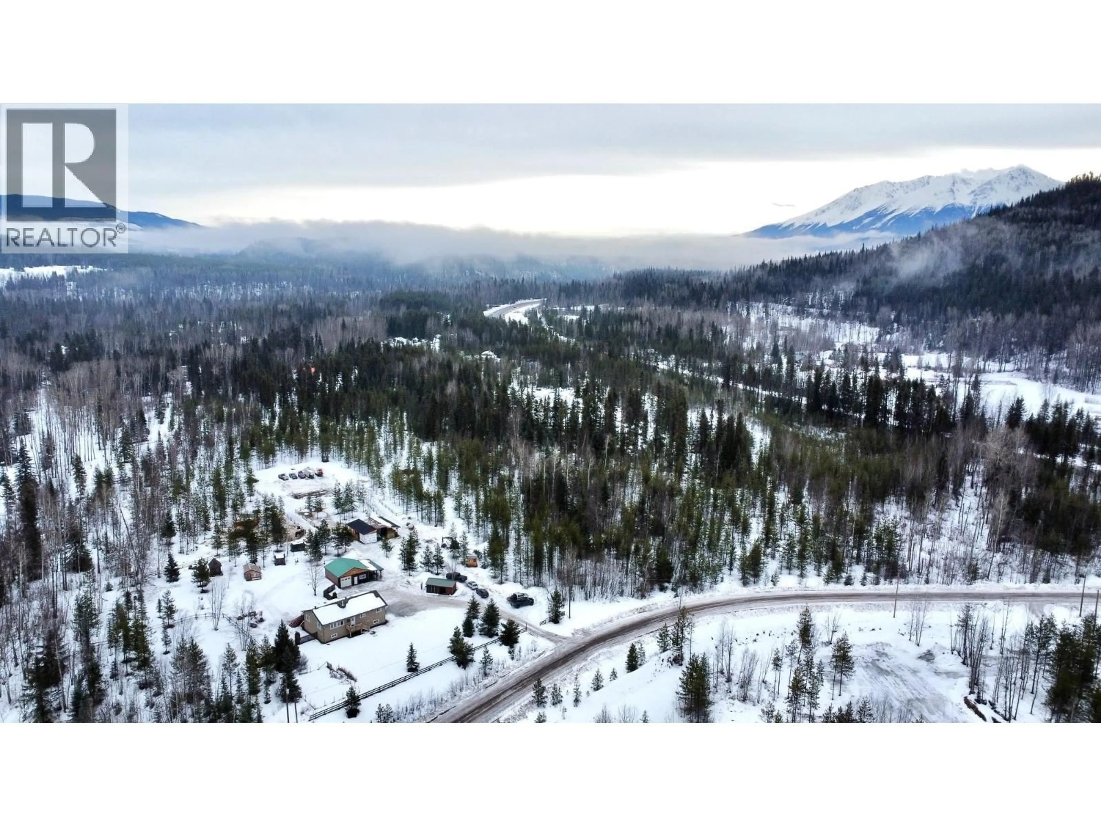 A pic from outside/outdoor area/front of a property/back of a property/a pic from drone, mountain view for 23998 RIVER ROAD, Smithers British Columbia V0J2N1