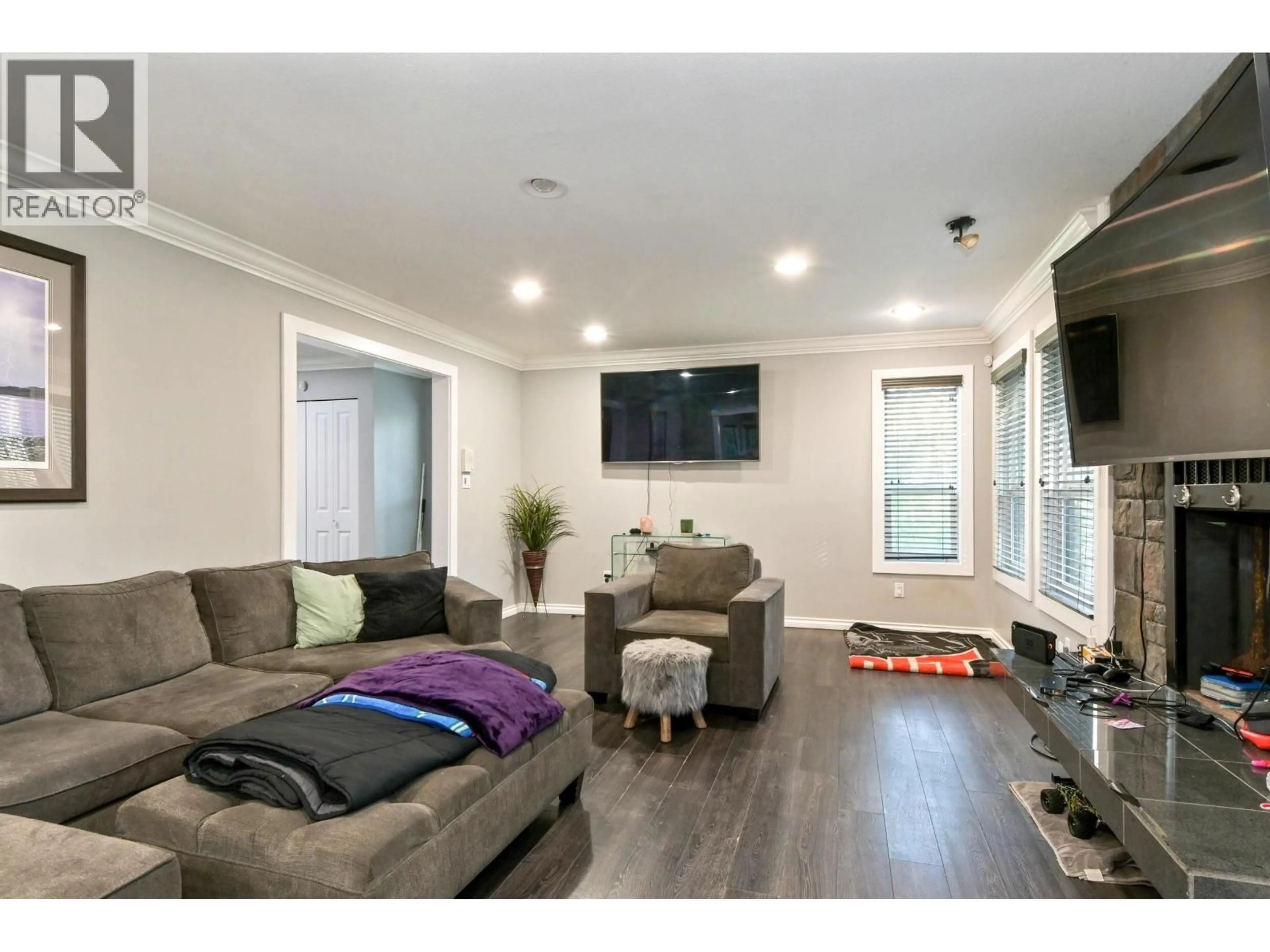 Living room with furniture, wood/laminate floor for 12707 BLUE MOUNTAIN CRESCENT, Maple Ridge British Columbia V2W1N7