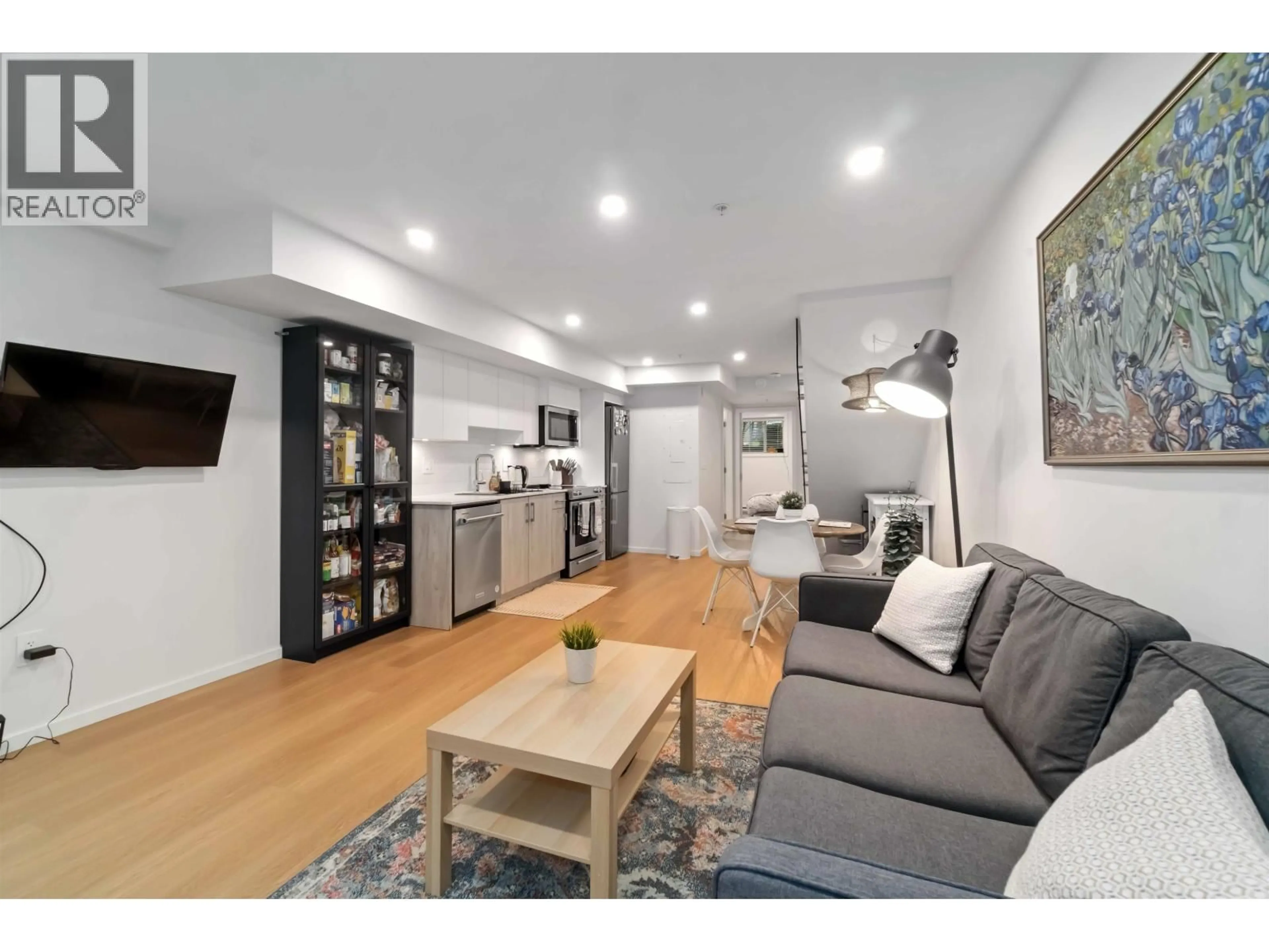 Living room with furniture, wood/laminate floor for 3623 RAE AVENUE, Vancouver British Columbia V5R2P6