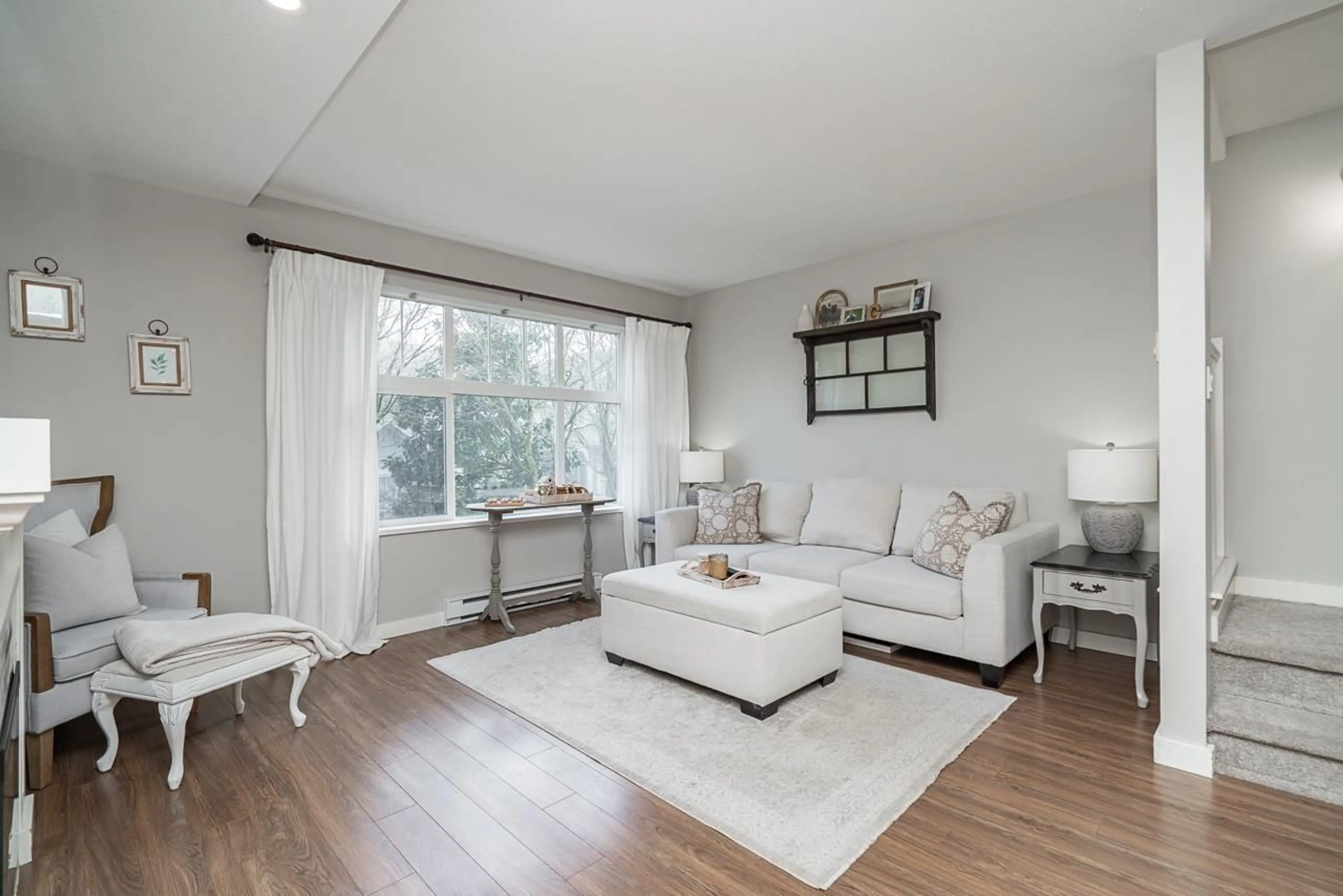 Living room with furniture, wood/laminate floor for 164 - 15236 36 AVENUE, Surrey British Columbia V3S2B3