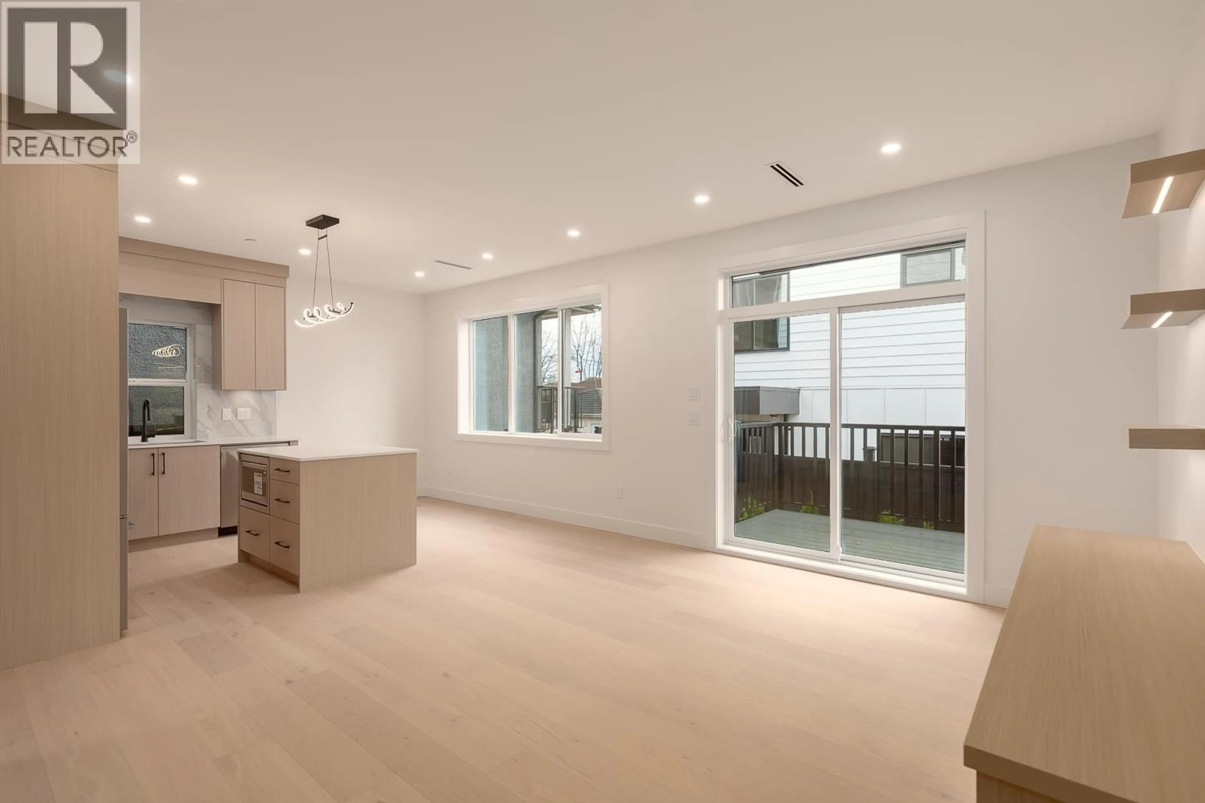 Open concept kitchen, wood/laminate floor for 2 - 3508 PENDER STREET, Vancouver British Columbia V5K2E3