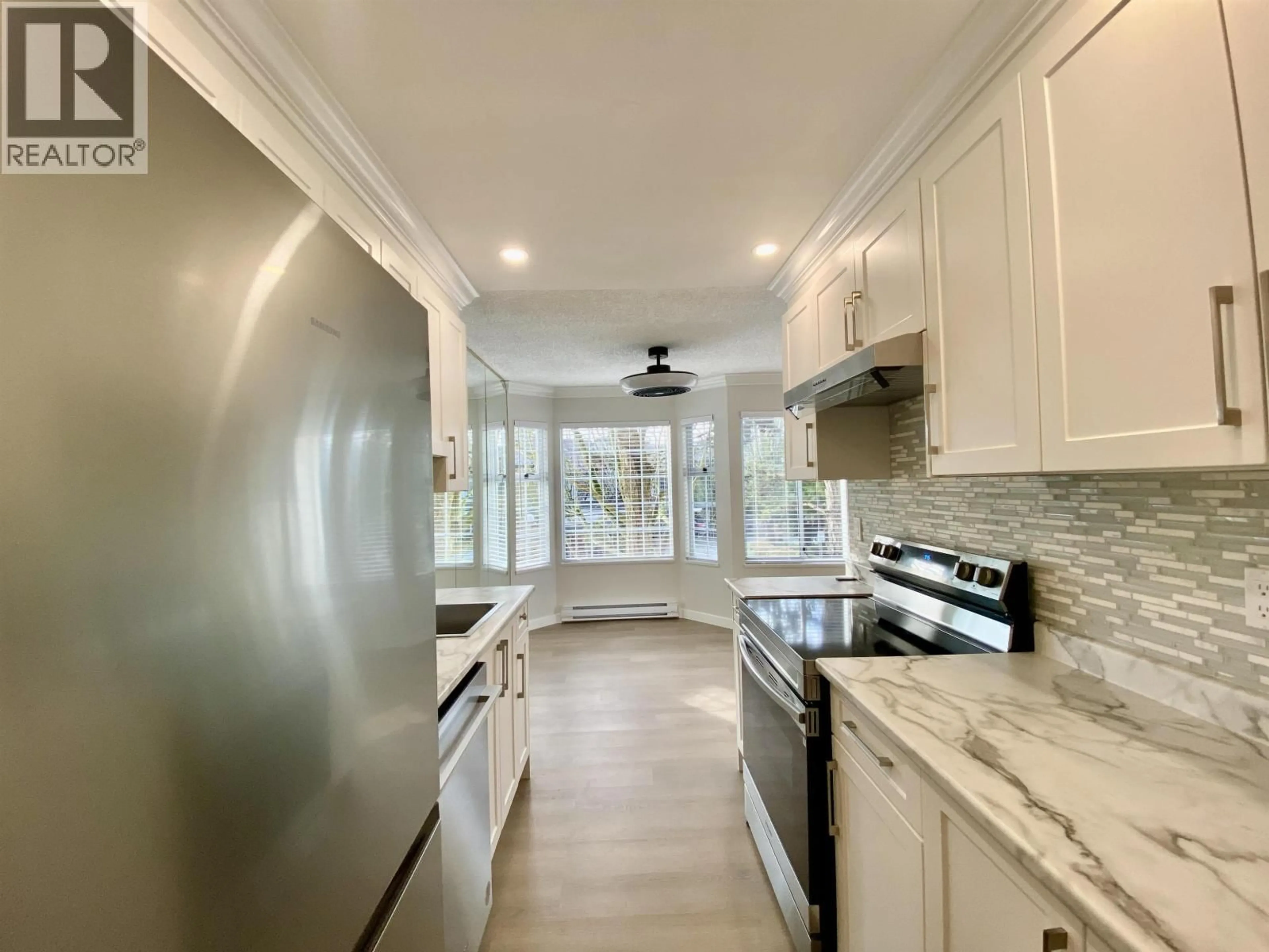 Open concept kitchen, ceramic/tile floor for 115 - 7591 MOFFATT ROAD, Richmond British Columbia V6Y3N2