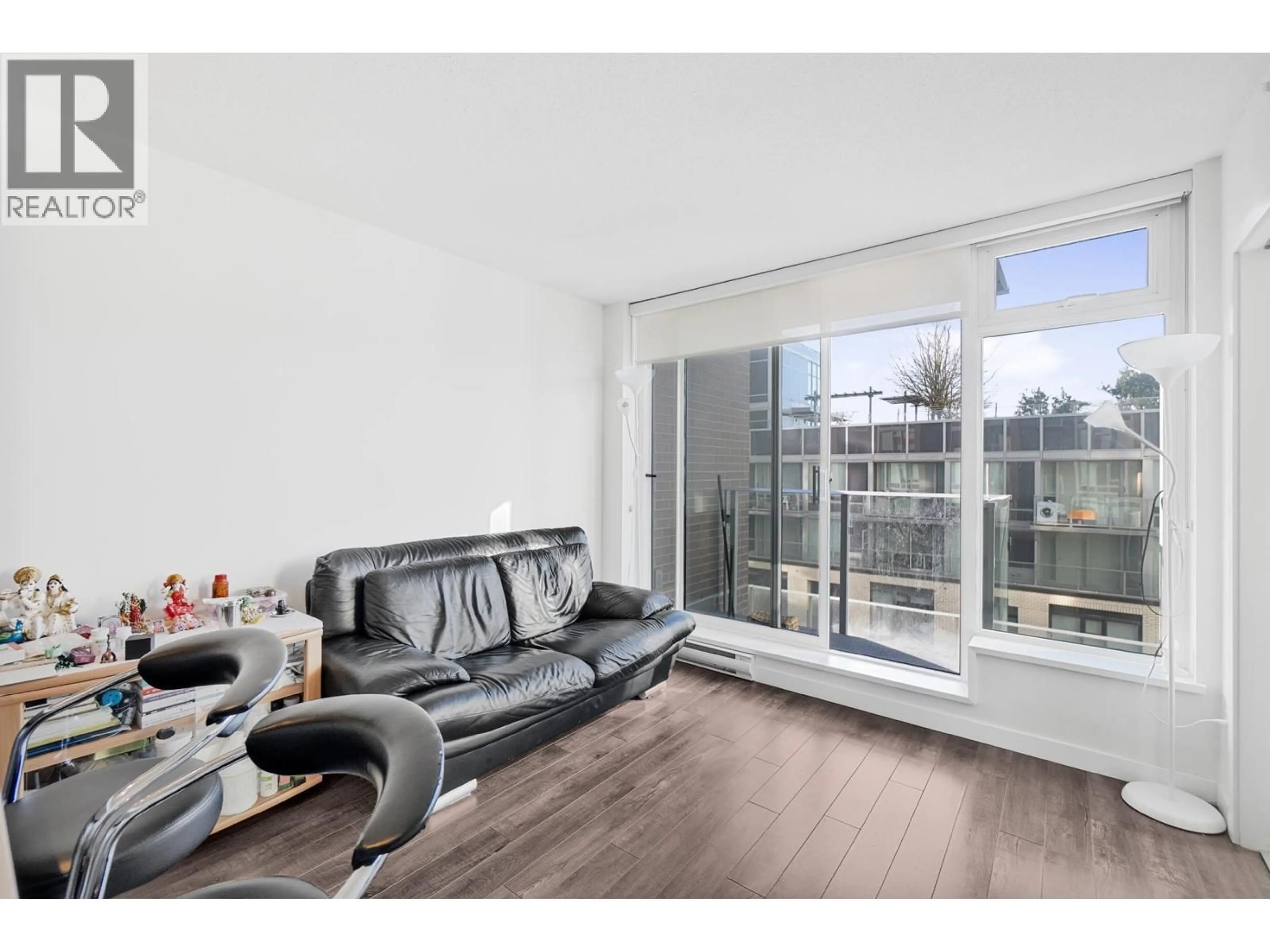 Living room with furniture, wood/laminate floor for 507 - 5665 BOUNDARY ROAD, Vancouver British Columbia V5R0E4