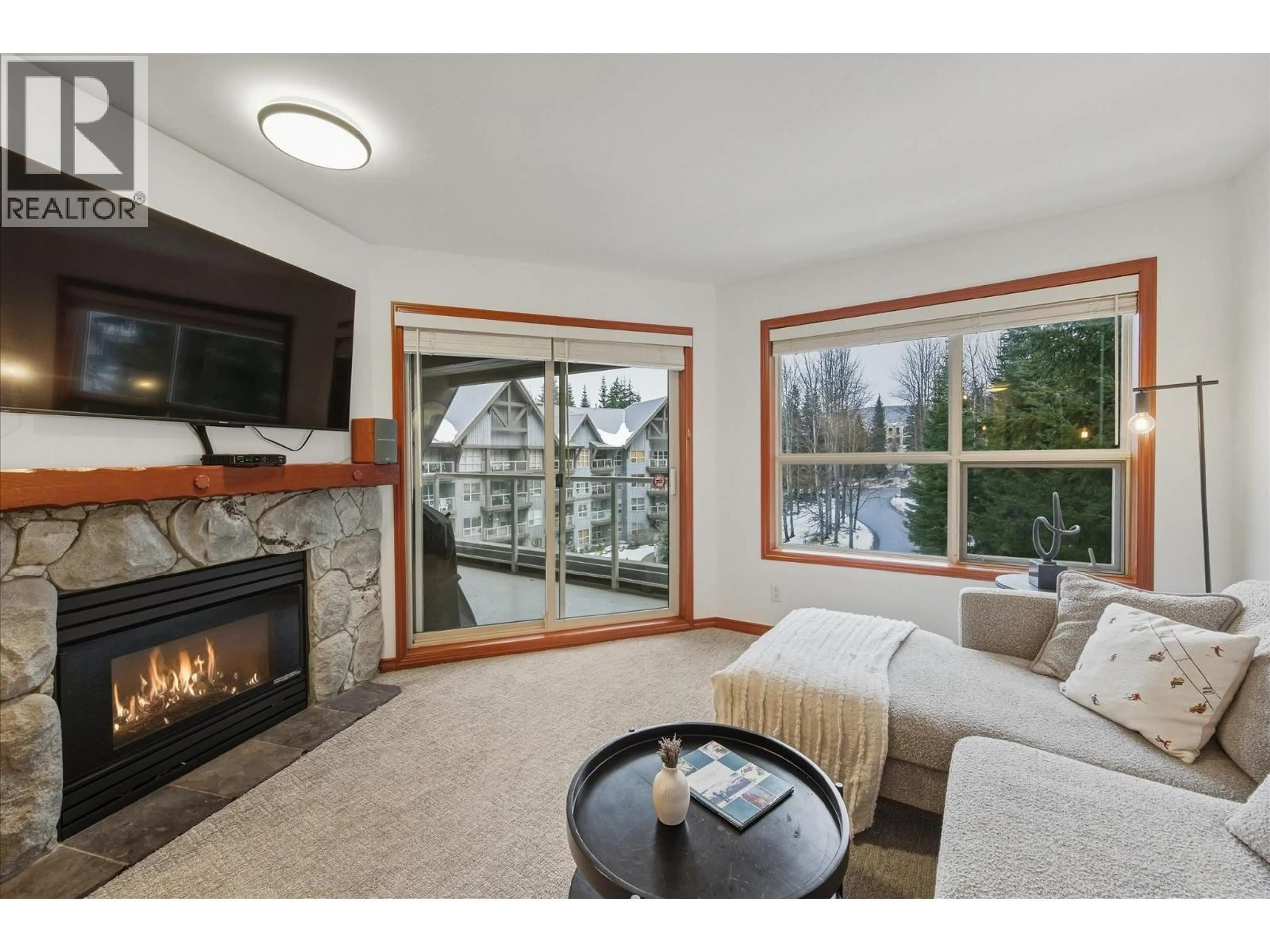 Living room with furniture, wood/laminate floor for 442 - 4800 SPEARHEAD DRIVE, Whistler British Columbia V8E1G1
