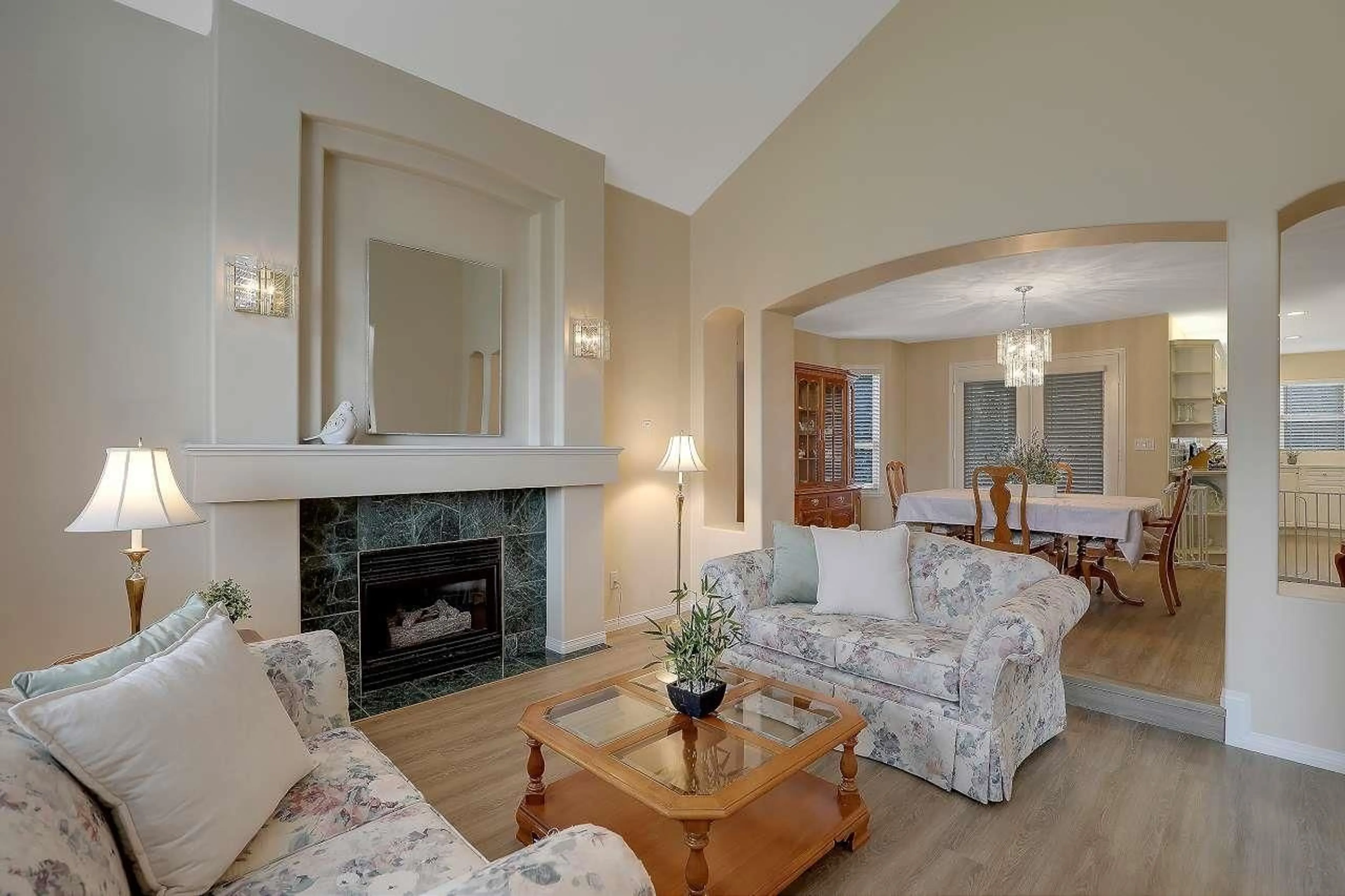 Living room with furniture, wood/laminate floor for 8020 KESTREL COURT, Surrey British Columbia V3W0V1