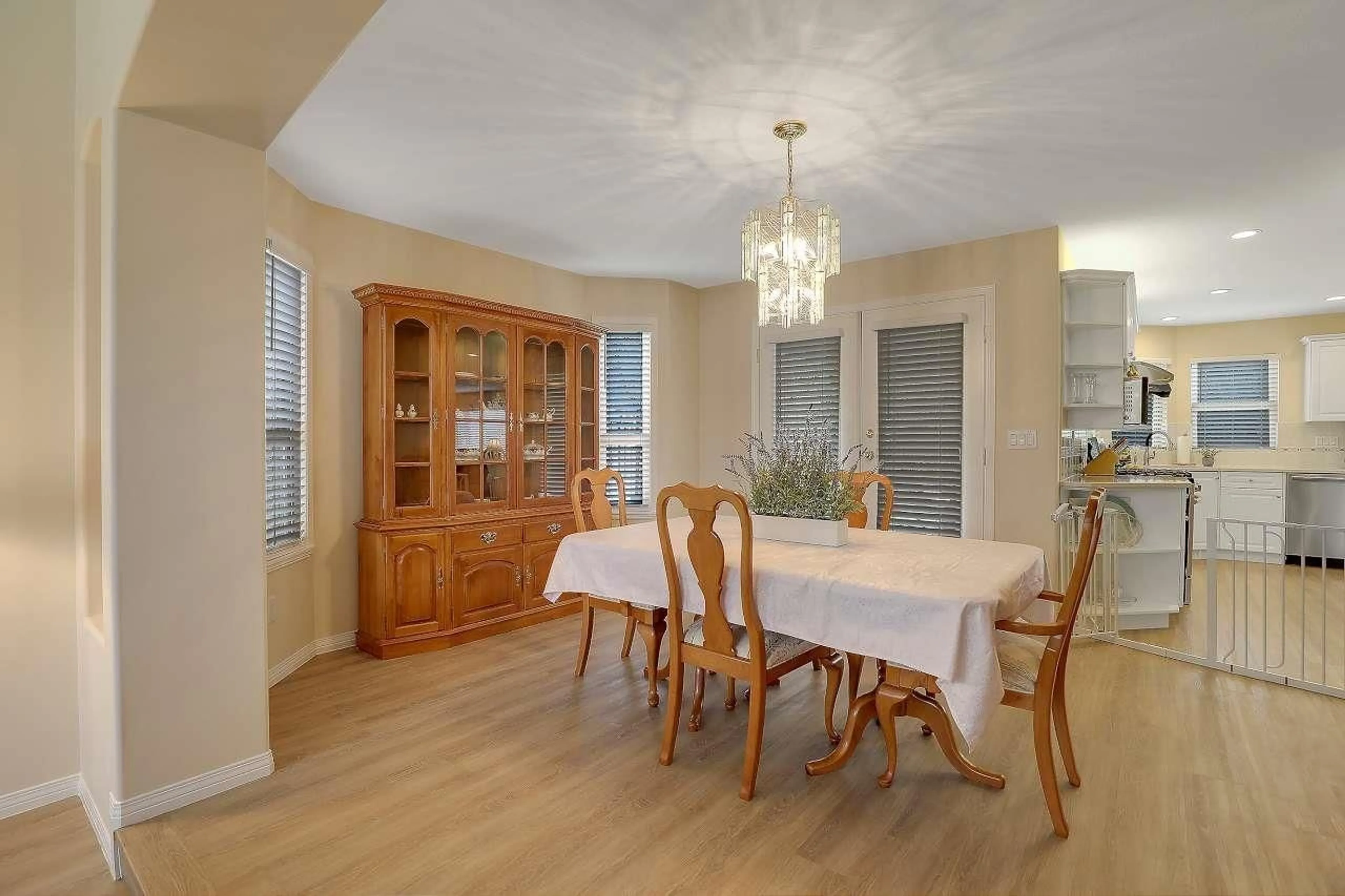 Dining room, wood/laminate floor for 8020 KESTREL COURT, Surrey British Columbia V3W0V1
