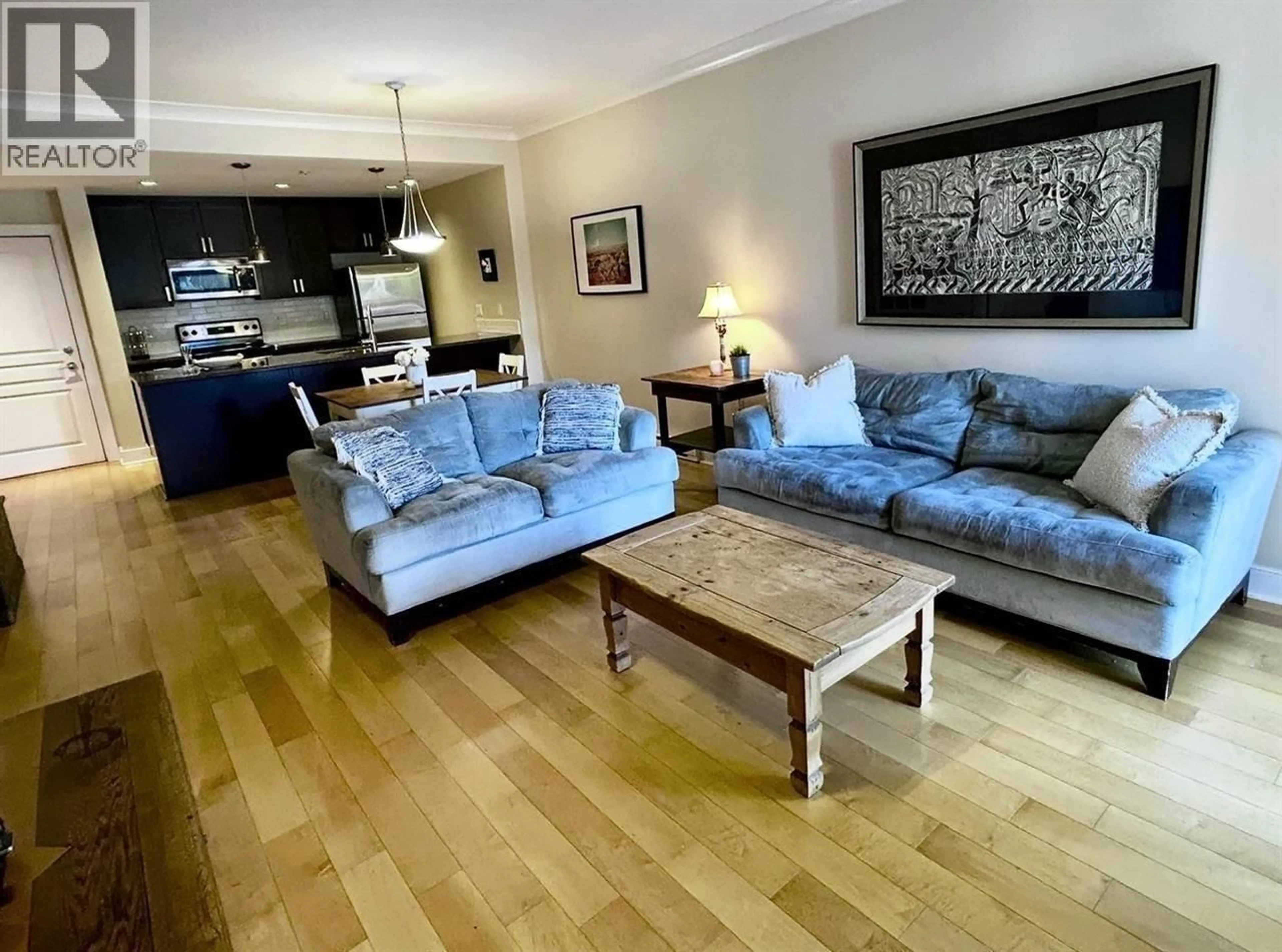 Living room with furniture, wood/laminate floor for 405 - 5599 14B AVENUE, Delta British Columbia V4M0A3