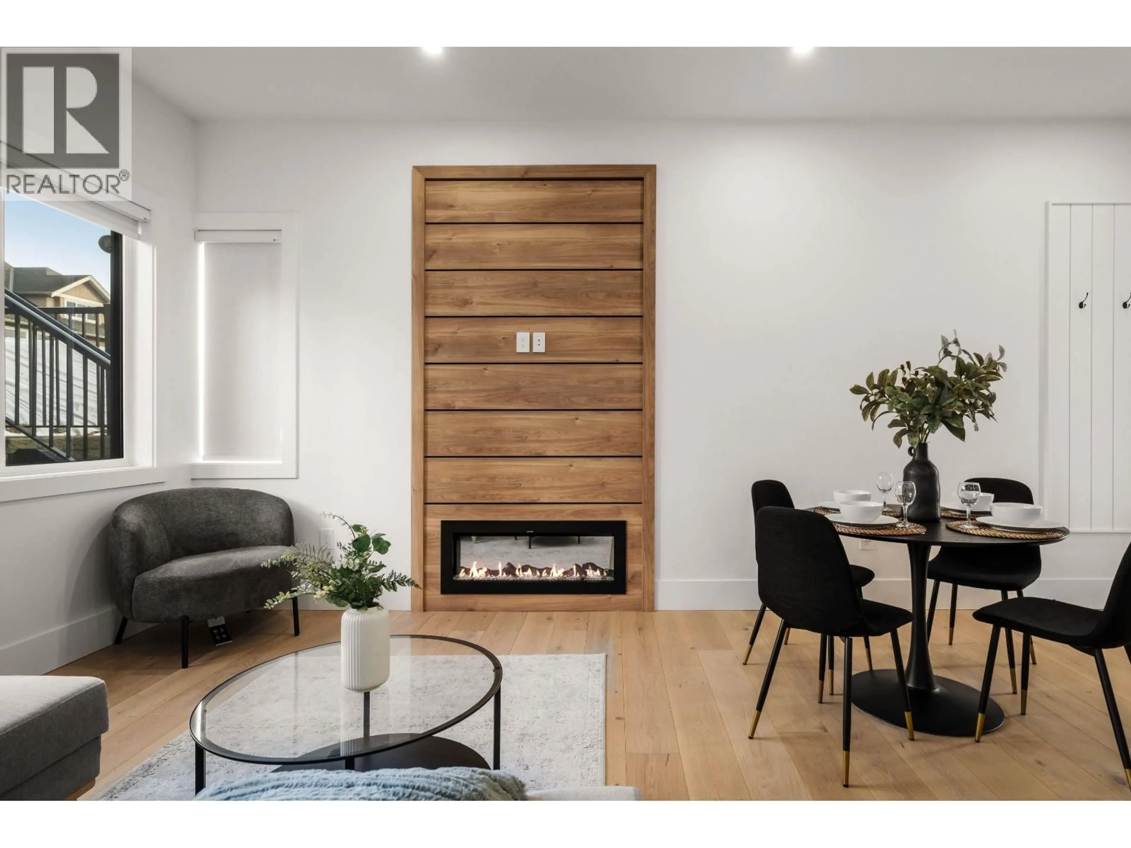 Living room with furniture, wood/laminate floor for 104 - 941 DANSEY AVENUE, Coquitlam British Columbia V3K3G8