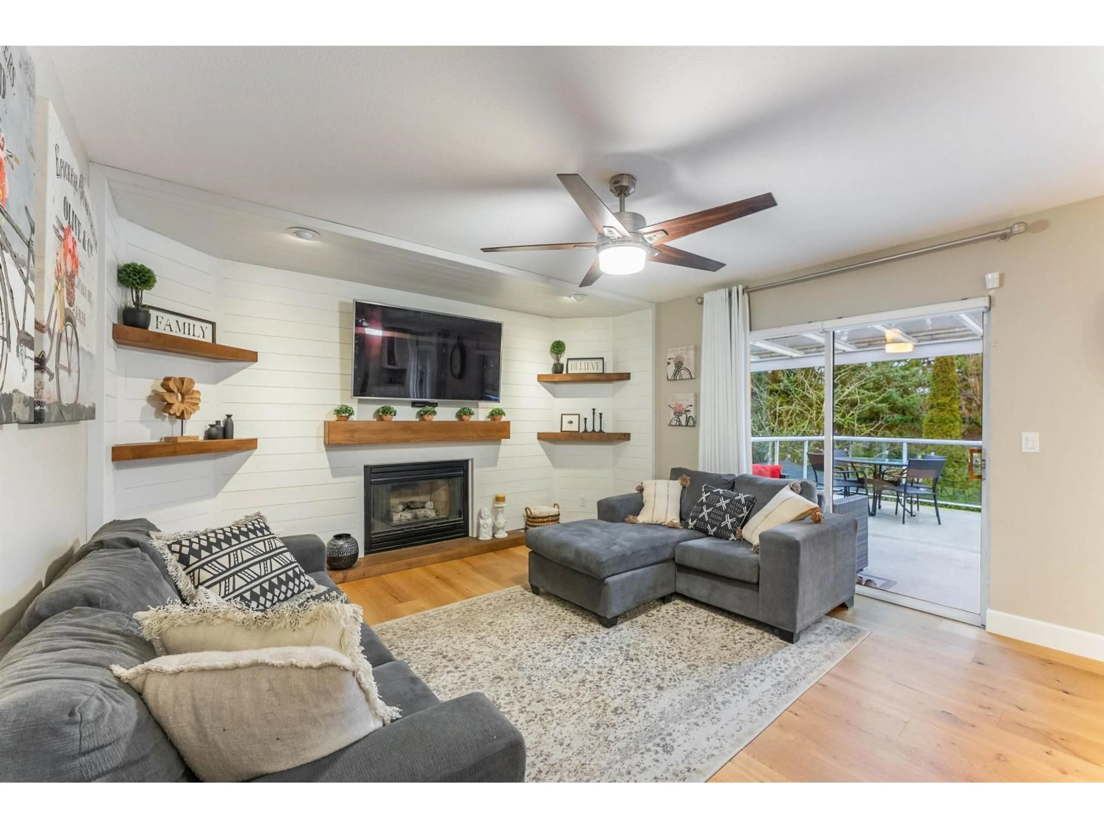 Living room with furniture, wood/laminate floor for 5912 190A STREET, Surrey British Columbia V3S7W5