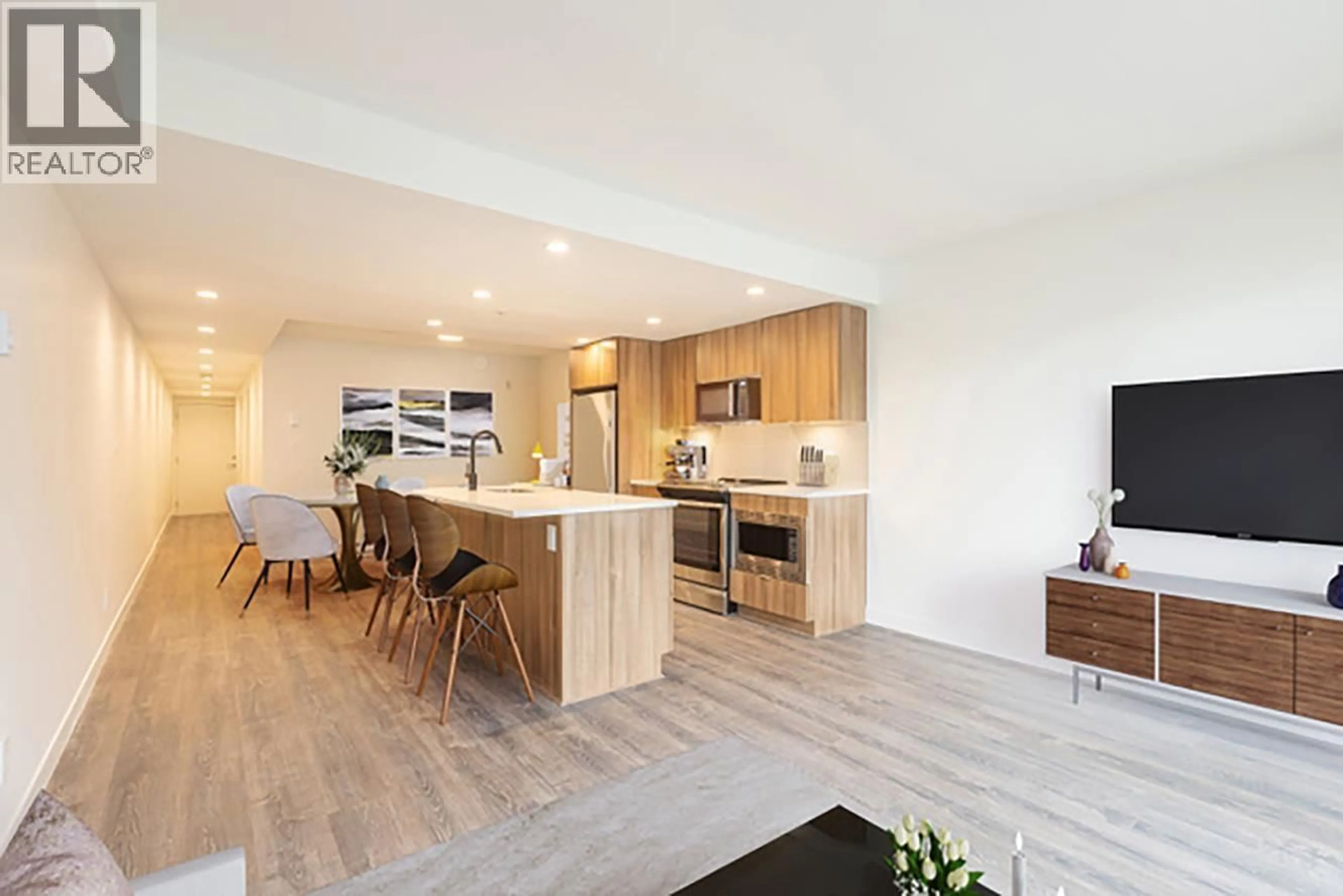 Open concept kitchen, wood/laminate floor for 207 - 1365 PEMBERTON AVENUE, Squamish British Columbia V8B1B7