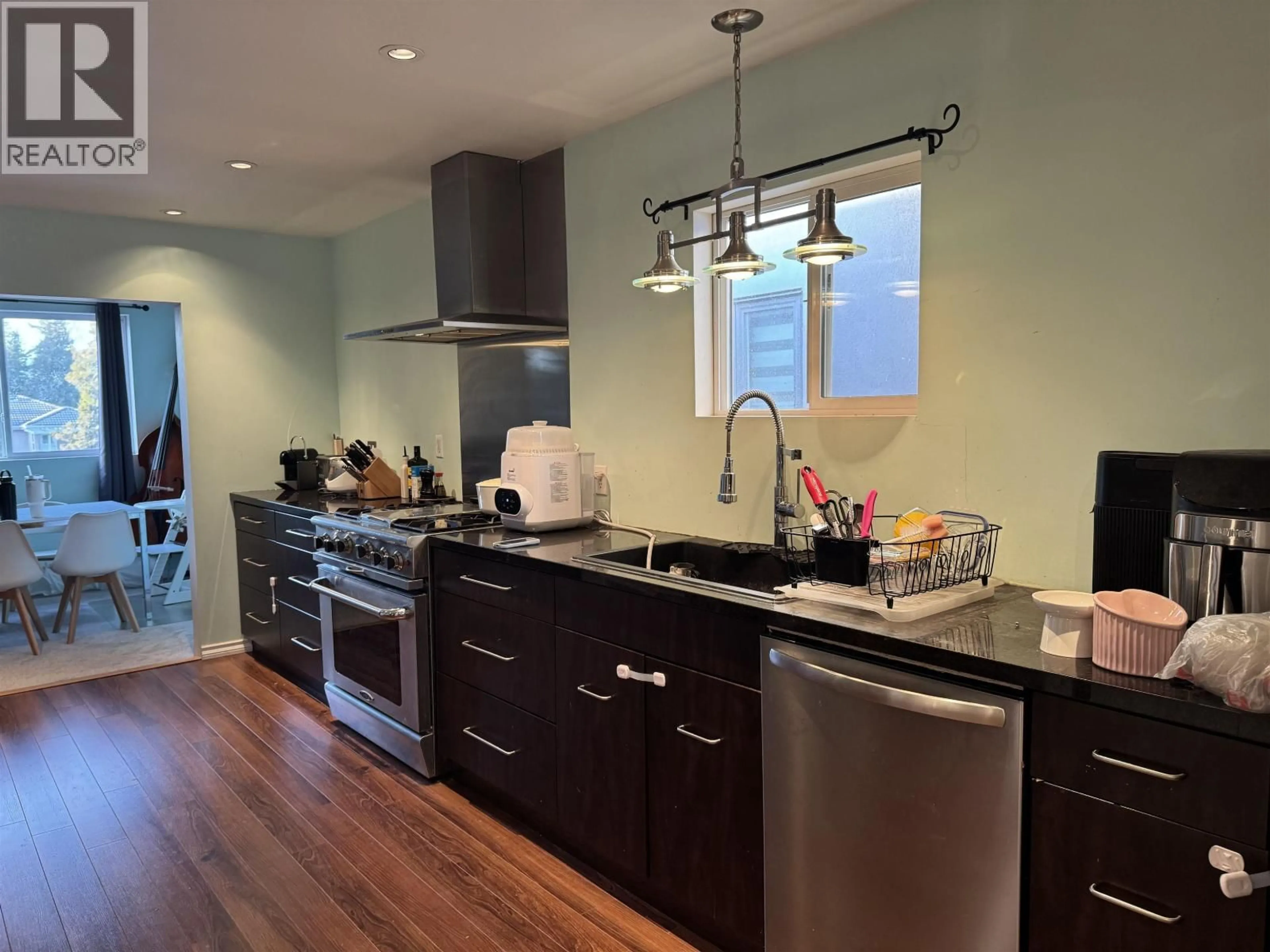 Open concept kitchen, wood/laminate floor for 8163 18TH AVENUE, Burnaby British Columbia V3N1K2