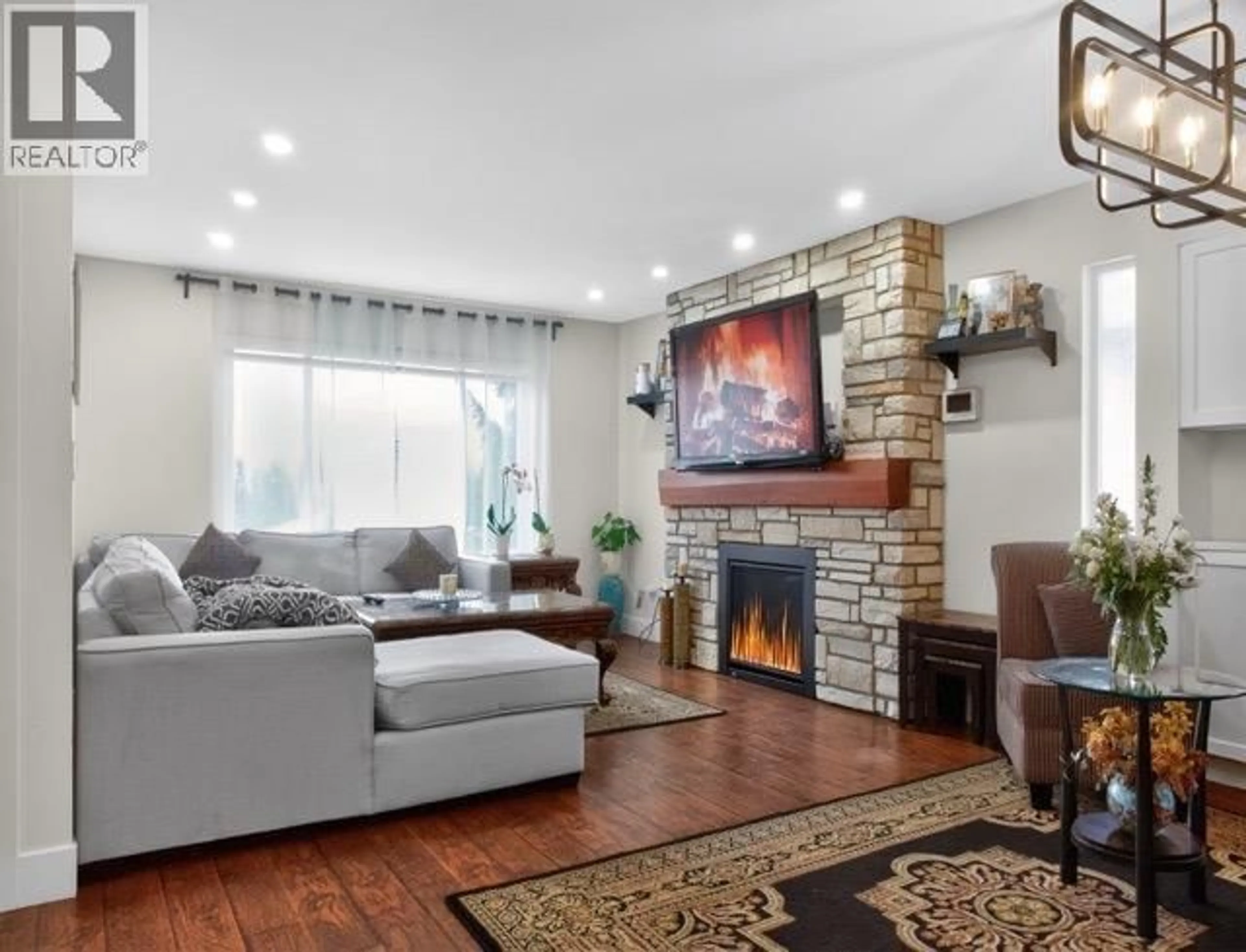 Living room with furniture, wood/laminate floor for 22905 113 AVENUE, Maple Ridge British Columbia V2X9S6