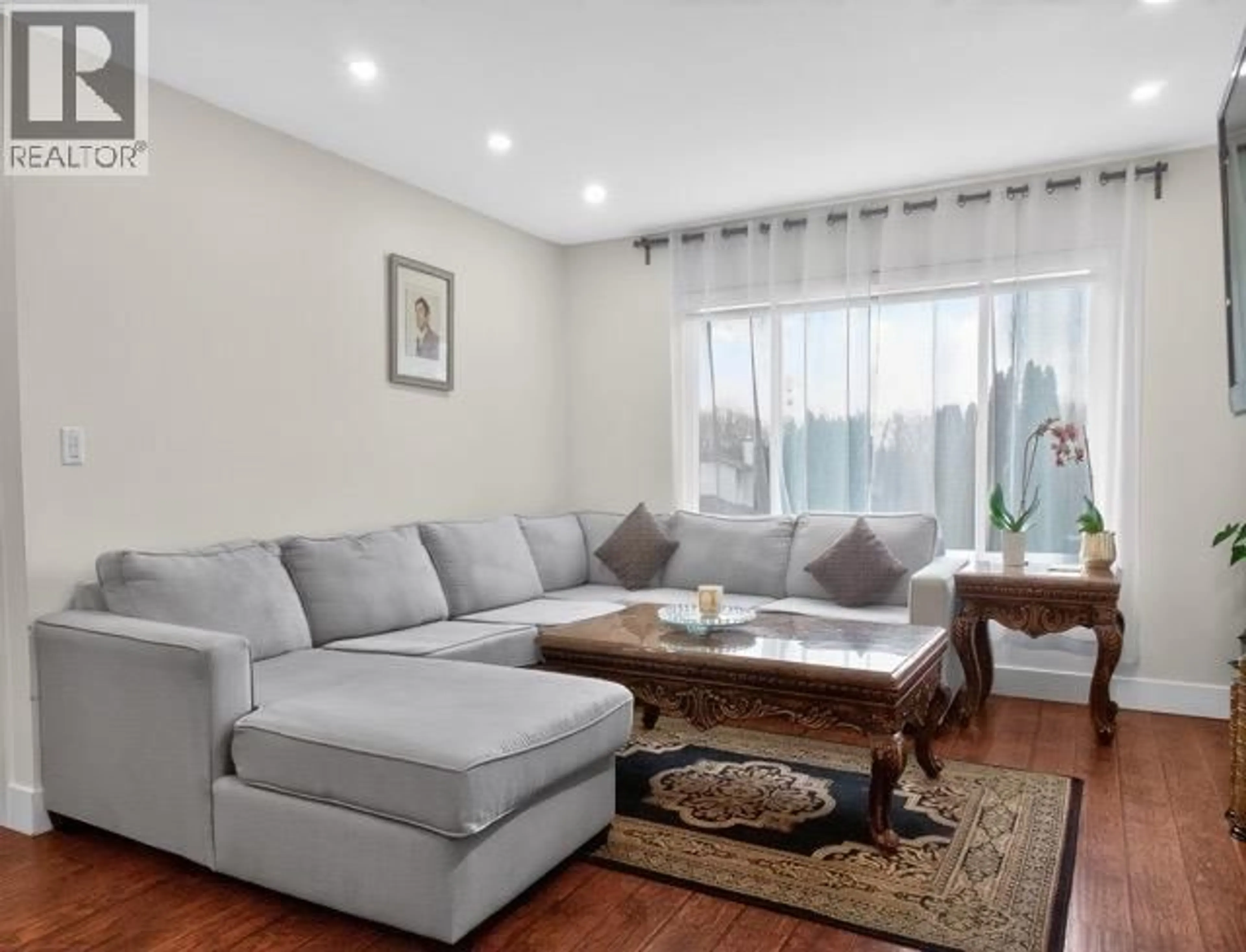 Living room with furniture, wood/laminate floor for 22905 113 AVENUE, Maple Ridge British Columbia V2X9S6