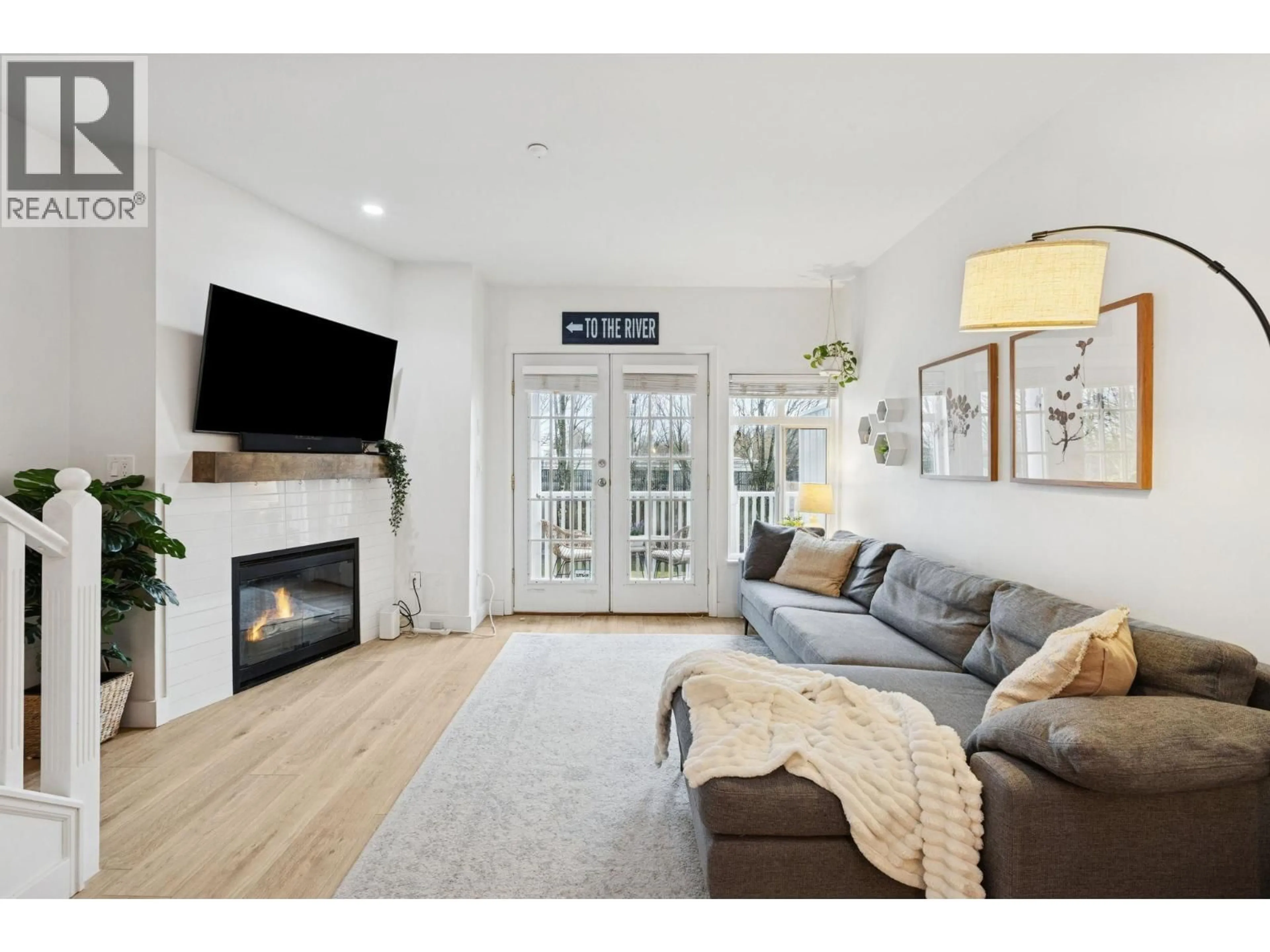 Living room with furniture, wood/laminate floor for 8528 LIGHTHOUSE WAY, Vancouver British Columbia V5S4T6