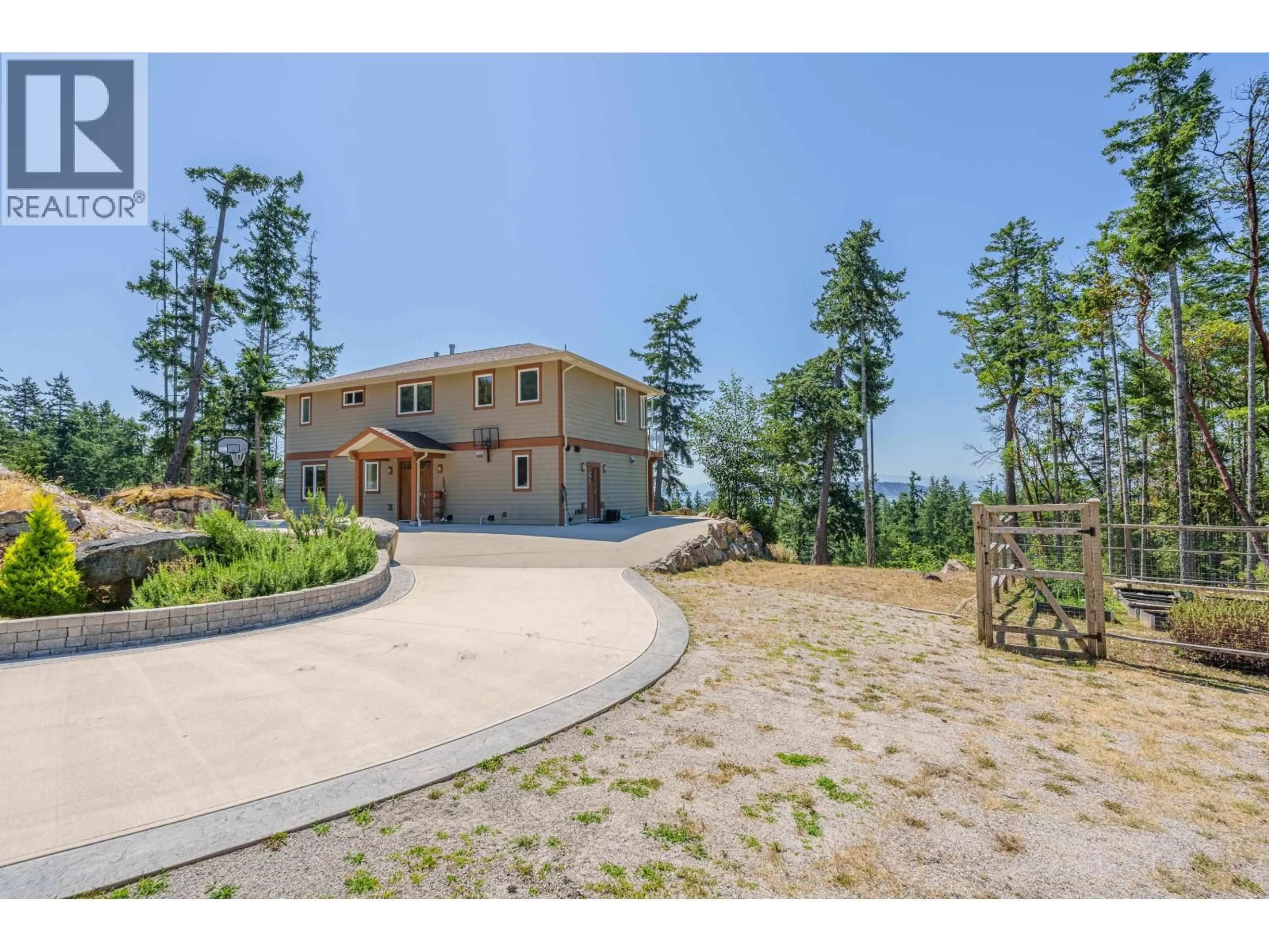 A pic from outside/outdoor area/front of a property/back of a property/a pic from drone, mountain view for 10825 WOOD BAY RIDGE ROAD, Halfmoon Bay British Columbia V7Z1B8
