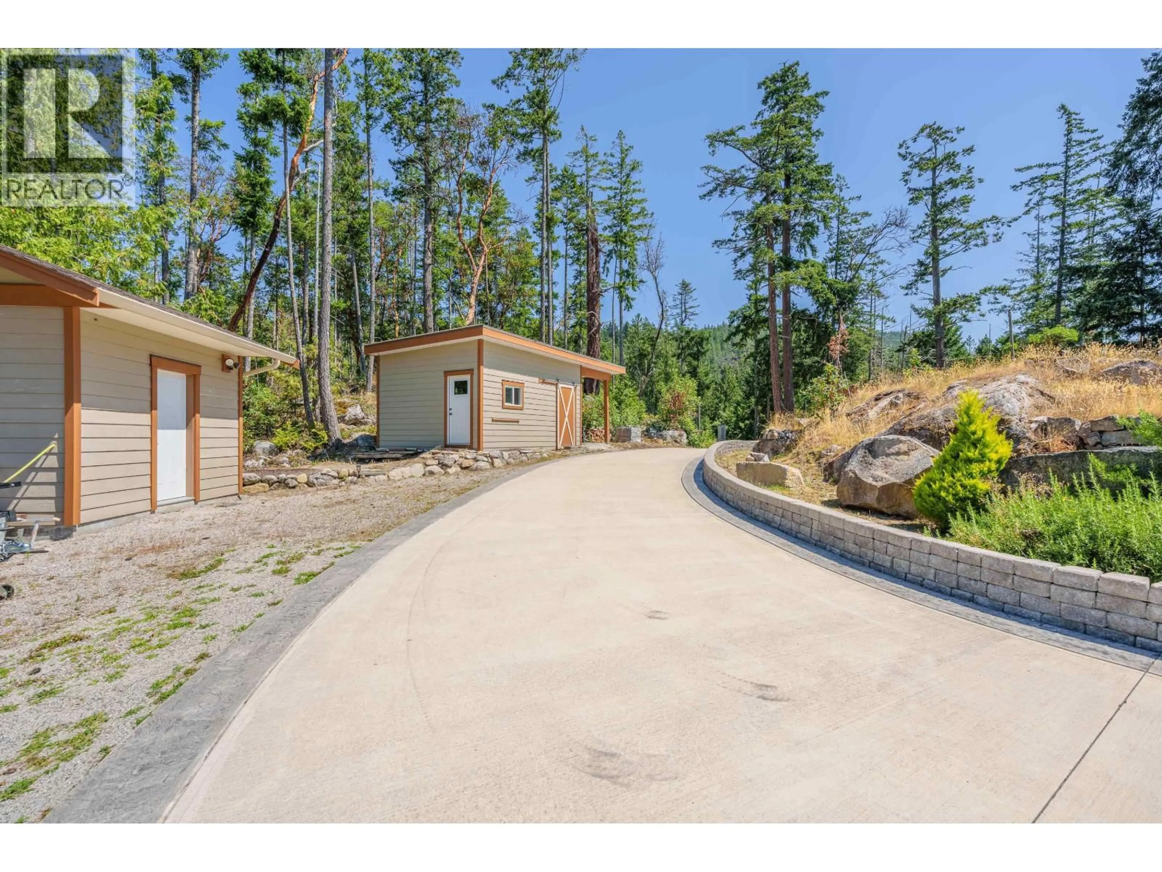 A pic from outside/outdoor area/front of a property/back of a property/a pic from drone, street for 10825 WOOD BAY RIDGE ROAD, Halfmoon Bay British Columbia V7Z1B8