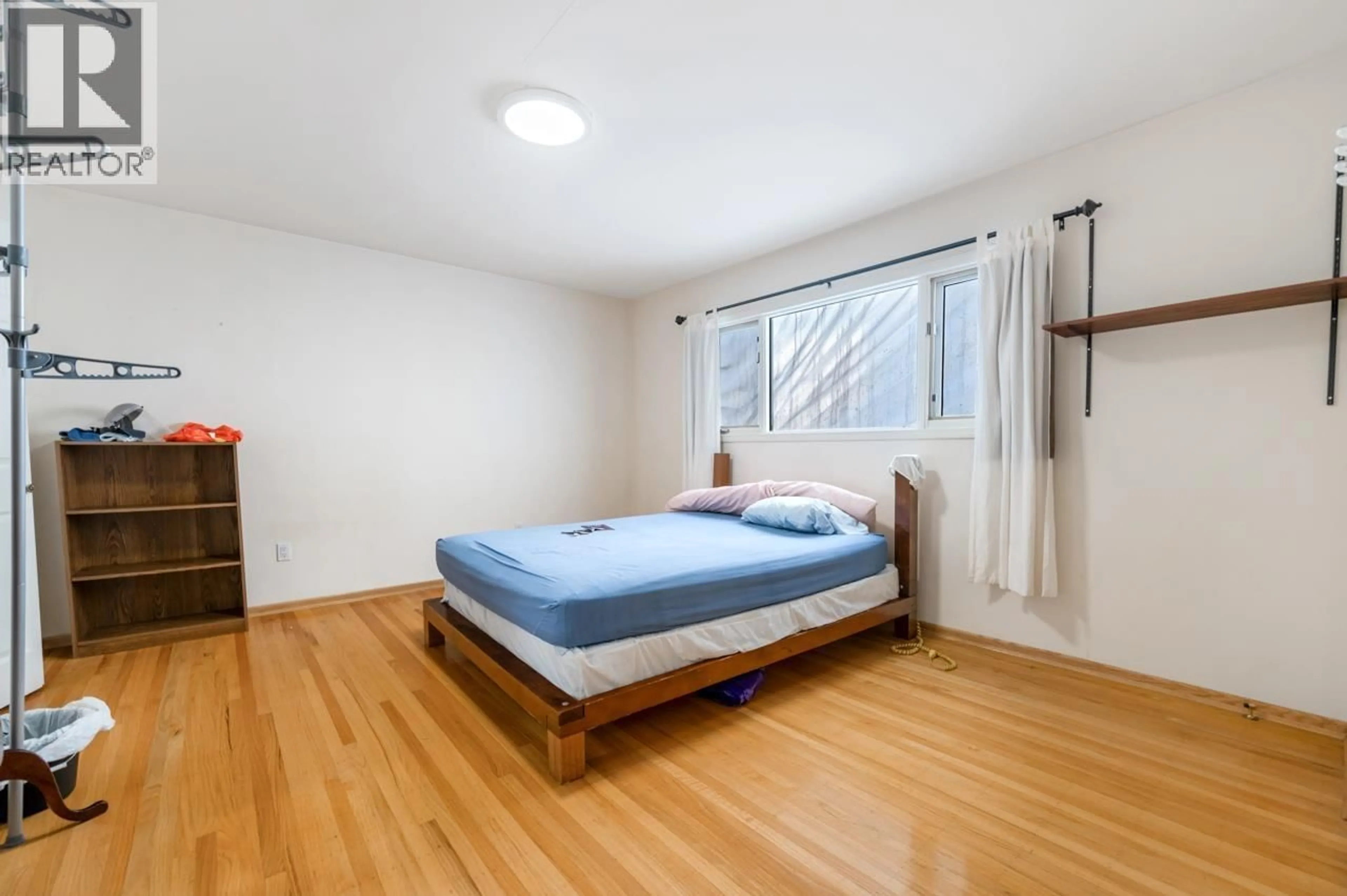 Bedroom with bed, wood/laminate floor for 5942 LAUREL STREET, Vancouver British Columbia V5Z3W3