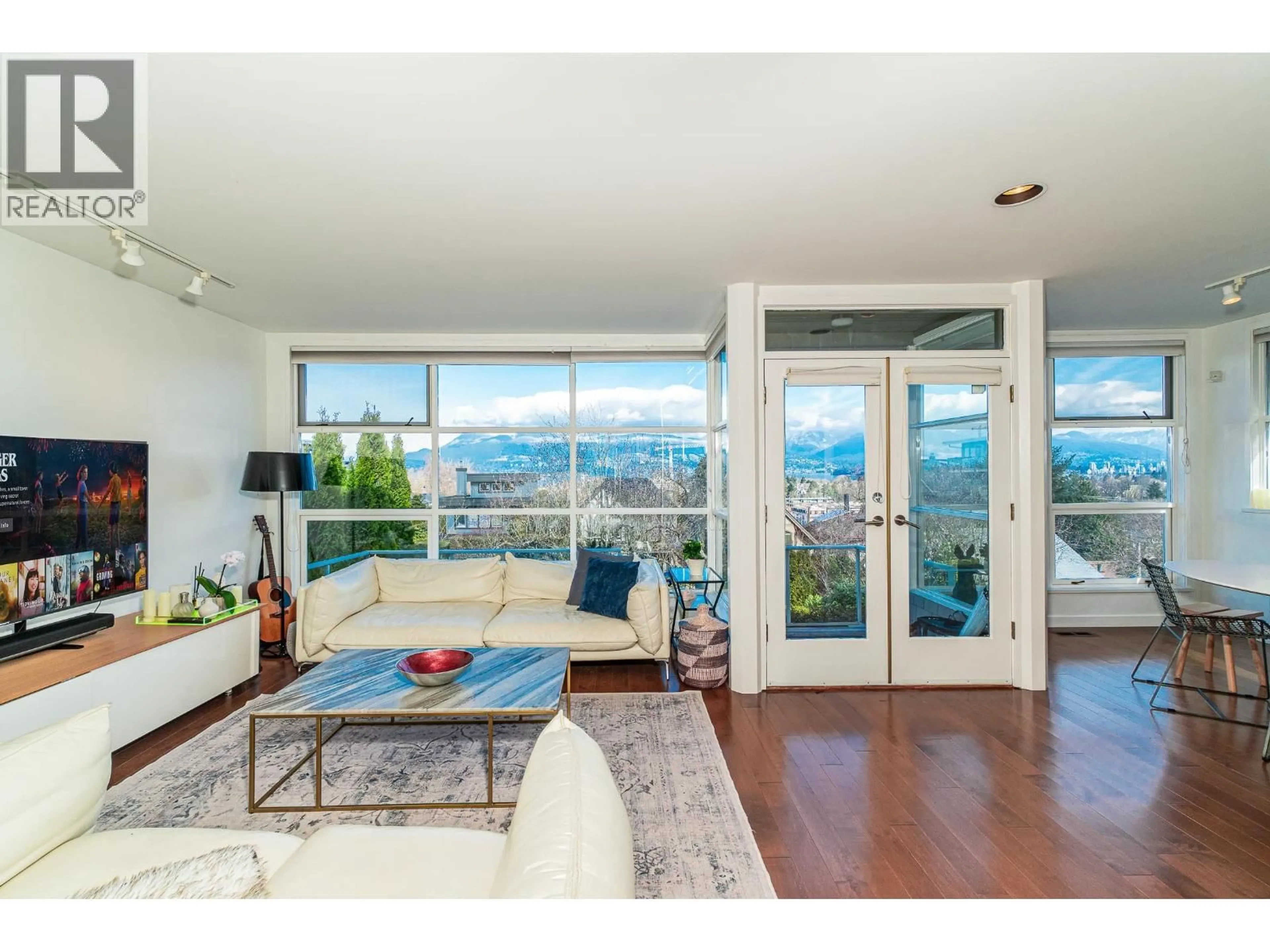 Living room with furniture, wood/laminate floor for 3762 13TH AVENUE, Vancouver British Columbia V6R2S6