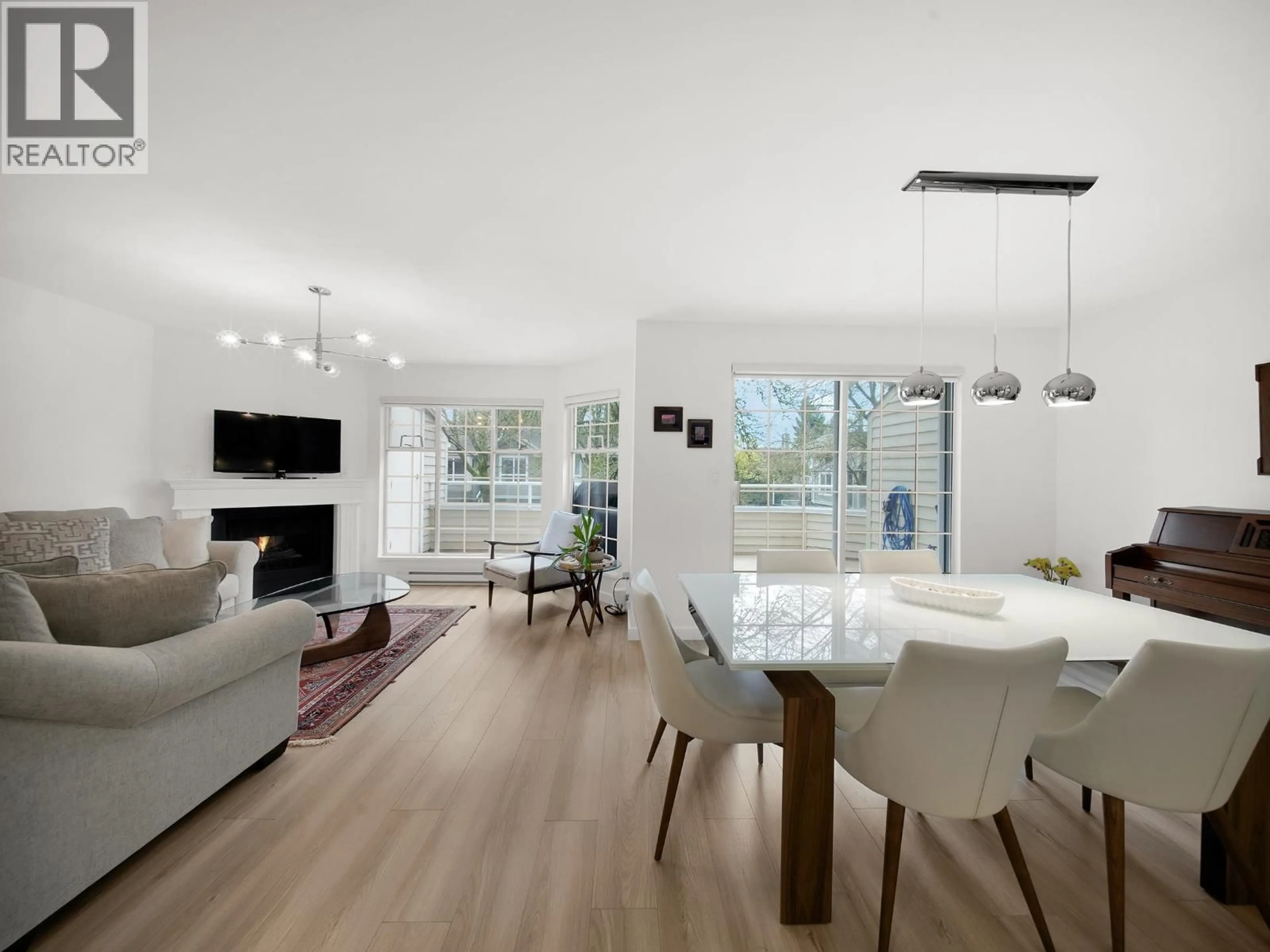 Living room with furniture, wood/laminate floor for 16 - 838 TOBRUCK AVENUE, North Vancouver British Columbia V7P1V9