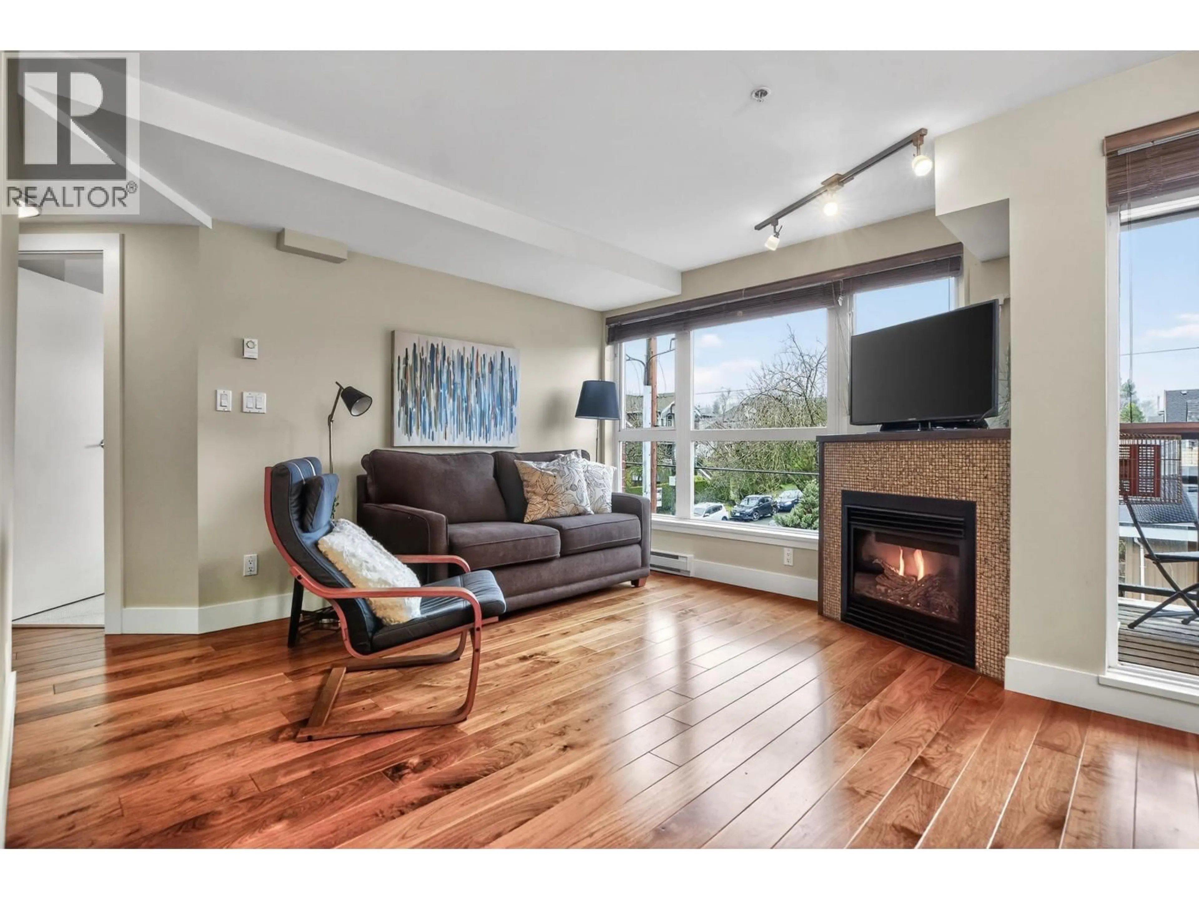 Living room with furniture, wood/laminate floor for 401 - 3611 18TH AVENUE, Vancouver British Columbia V6S1B3
